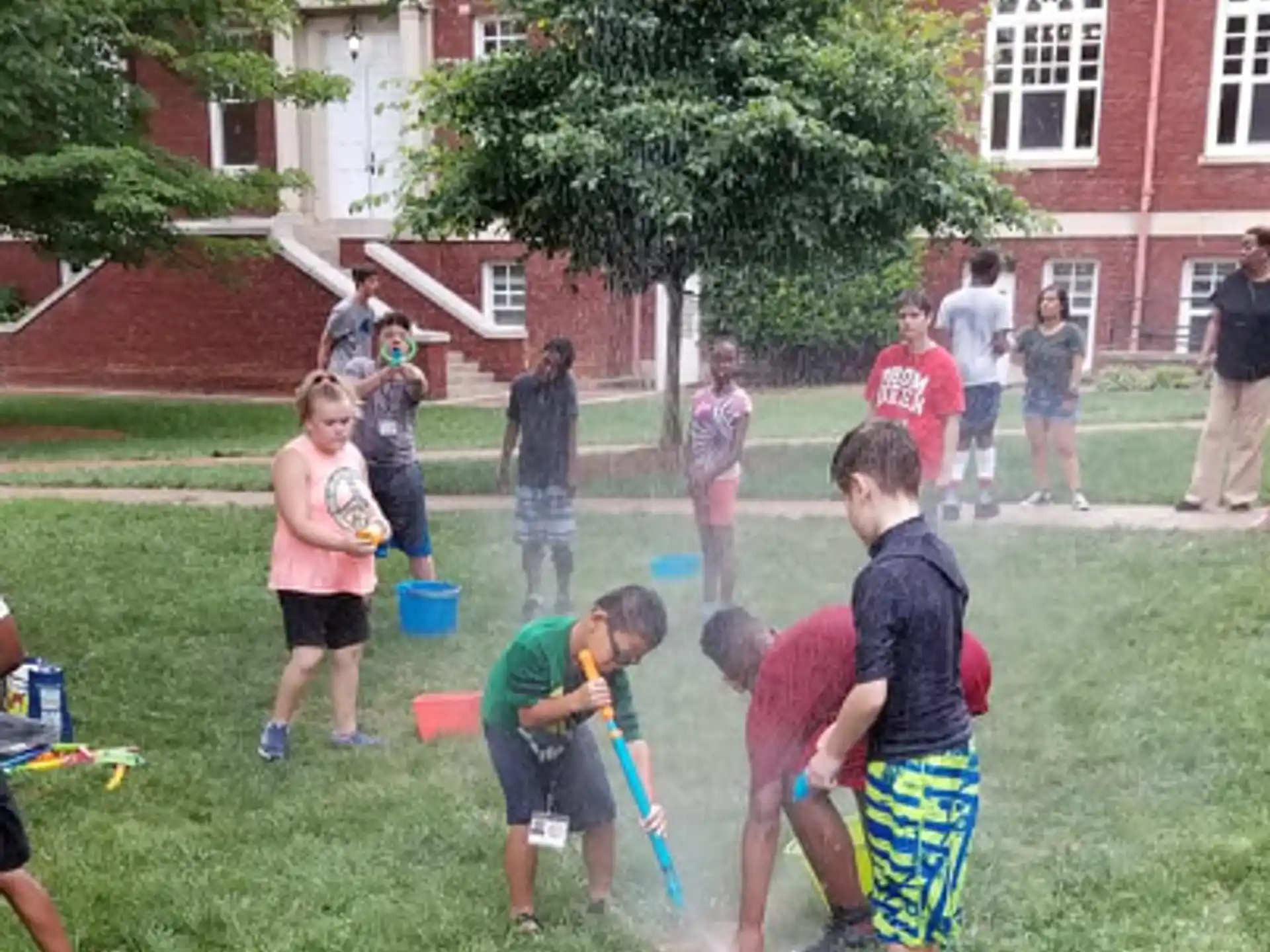a group of children playing in a yard