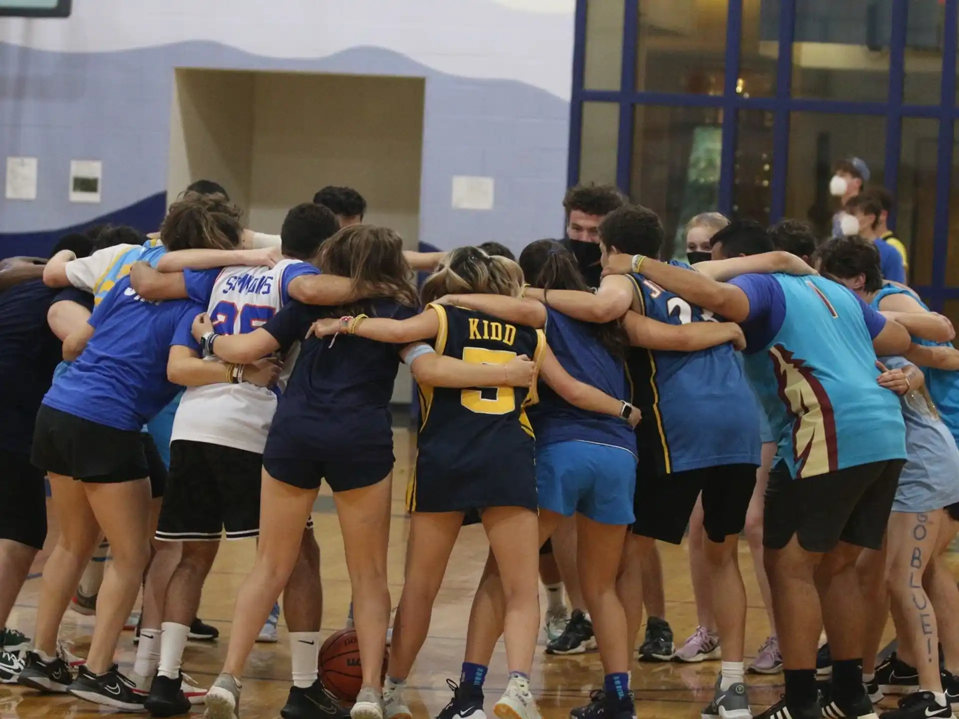 a group of people in a gym
