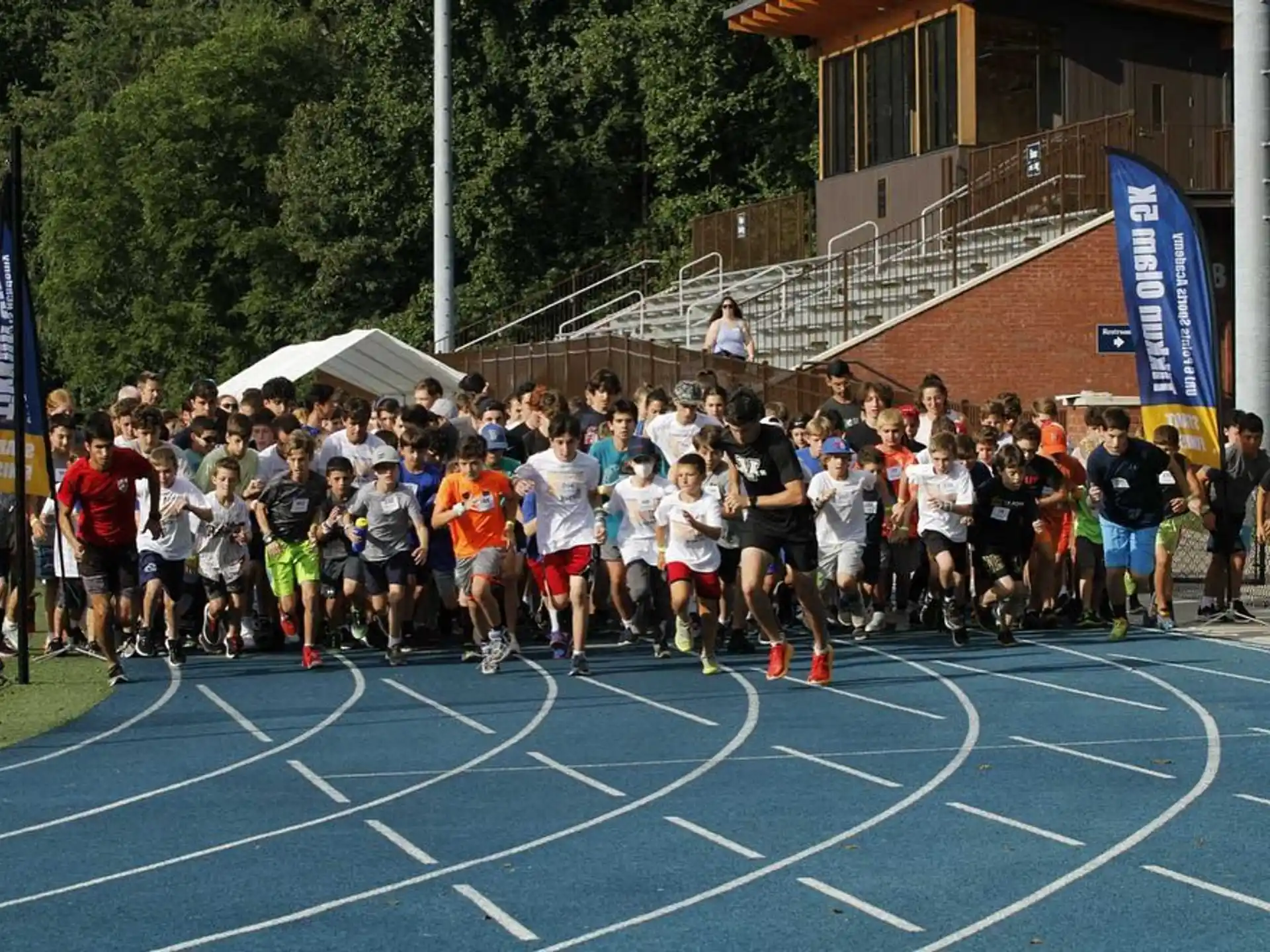 a group of people running on a track