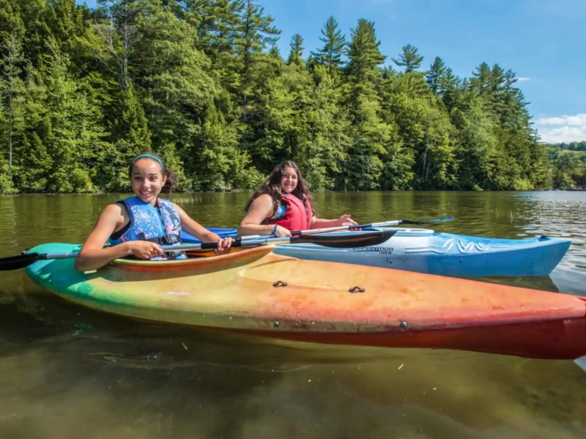 a couple of girls in a canoe