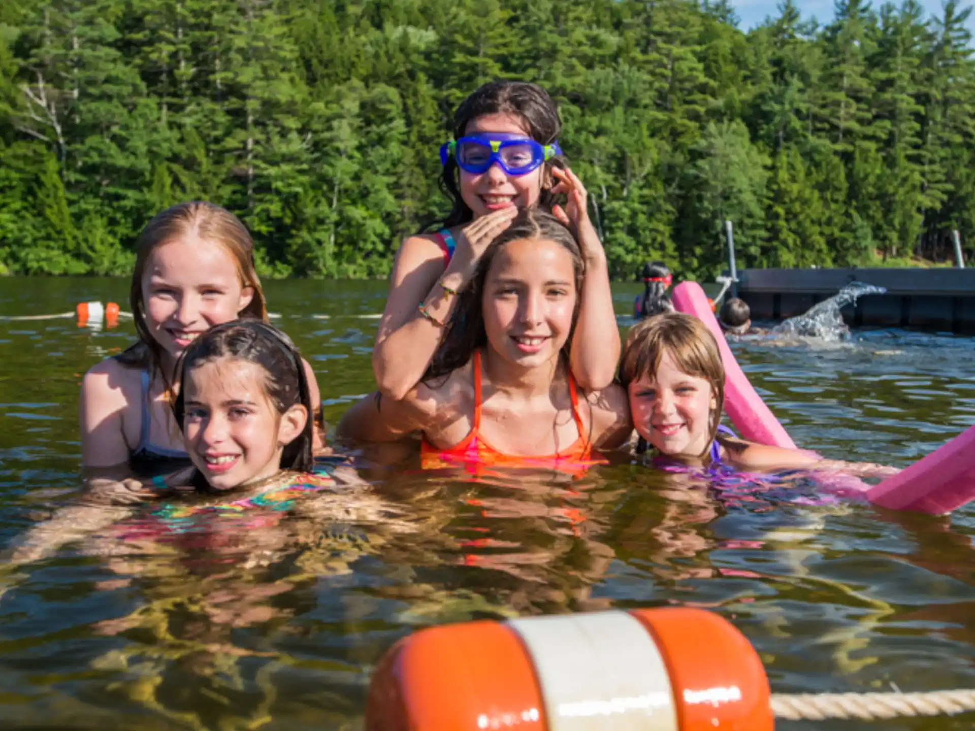 a group of children in a pool