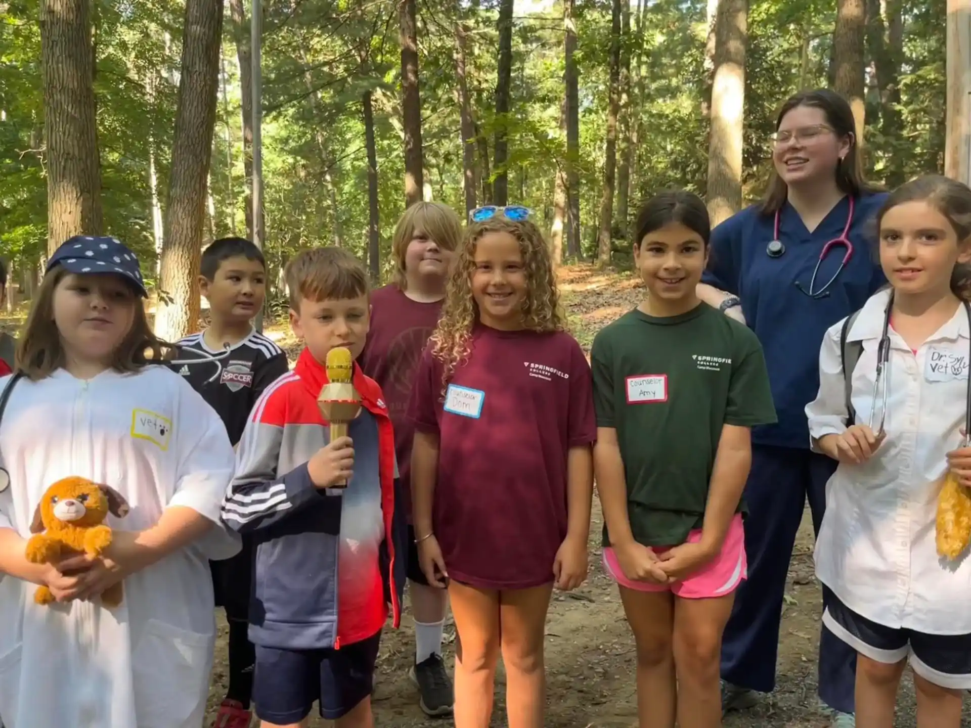 a group of people posing for a photo in the woods