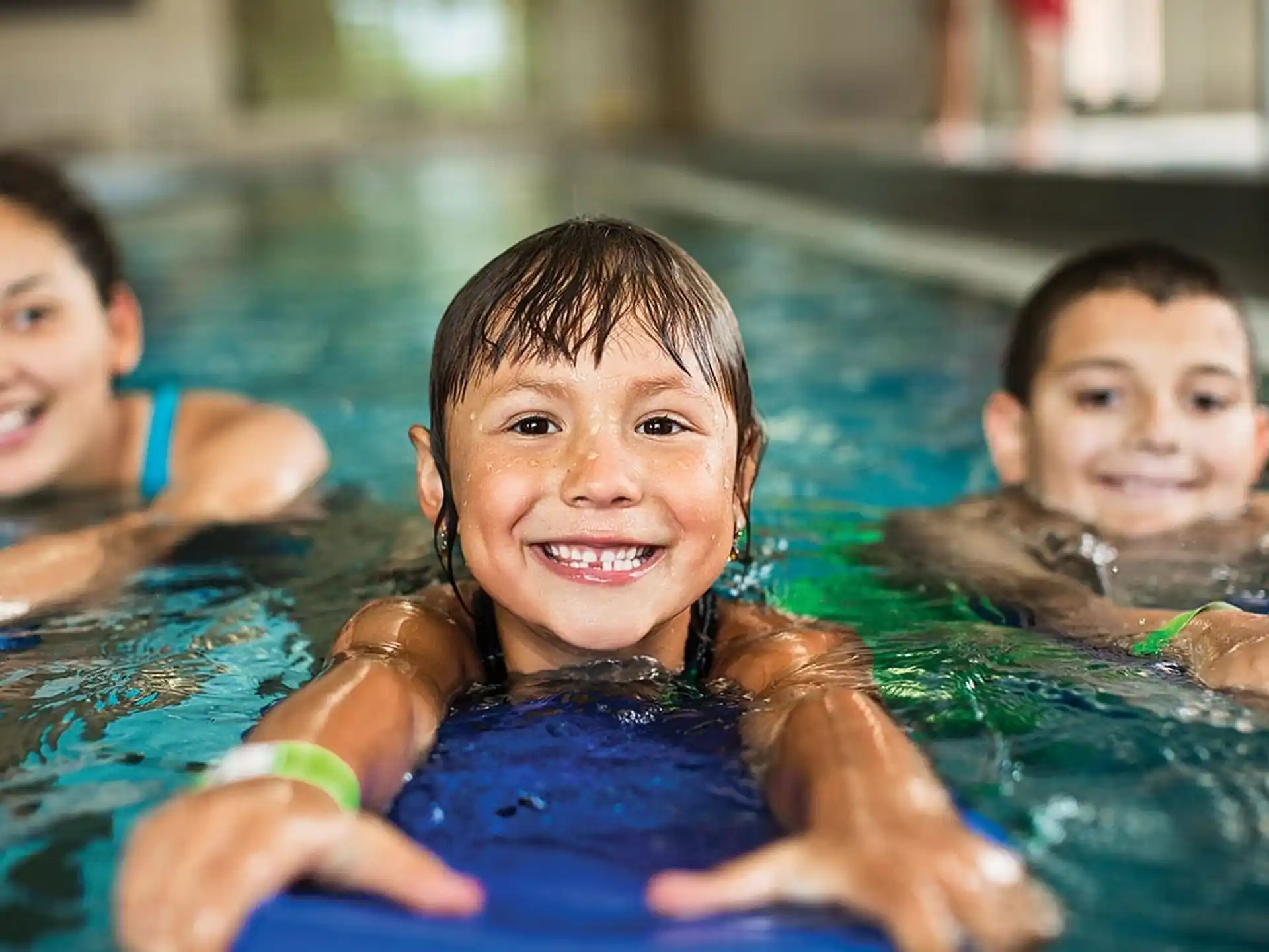 a group of children in a pool