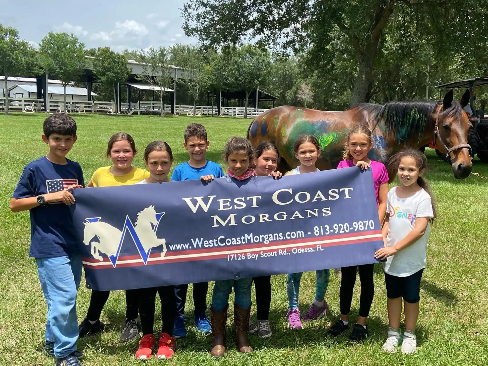a group of children holding a sign