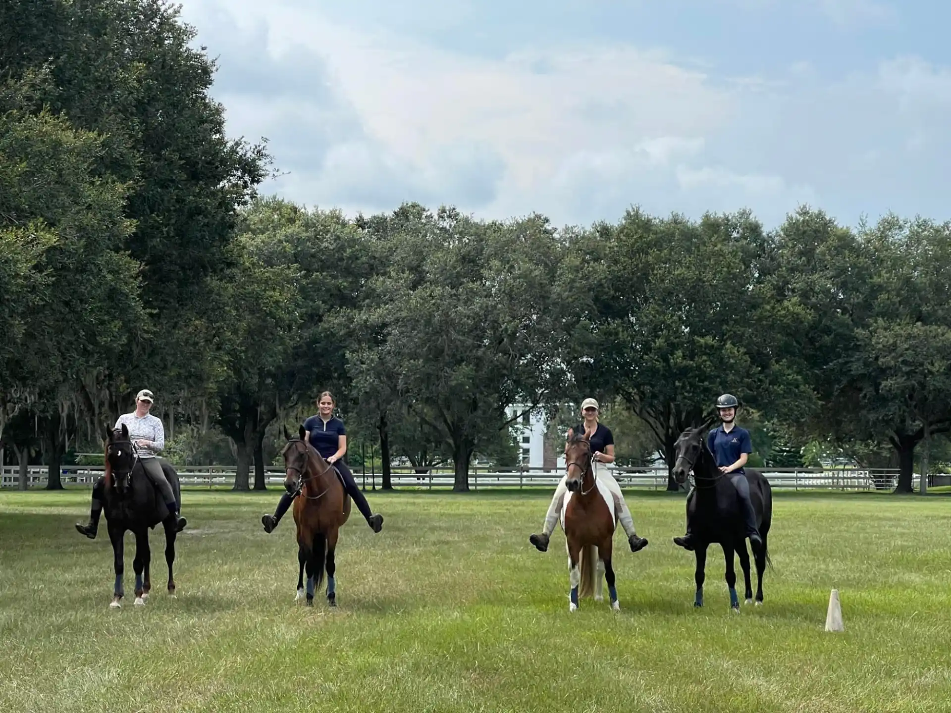 a group of people riding horses