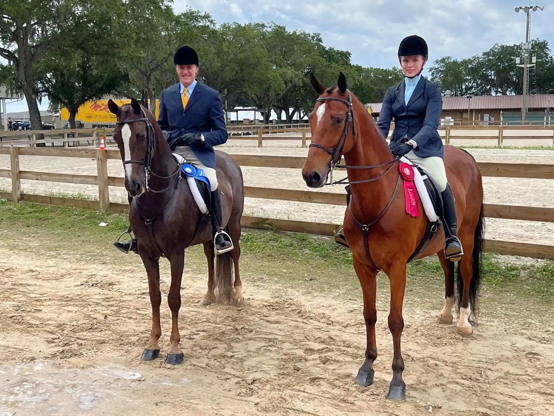 two people riding horses