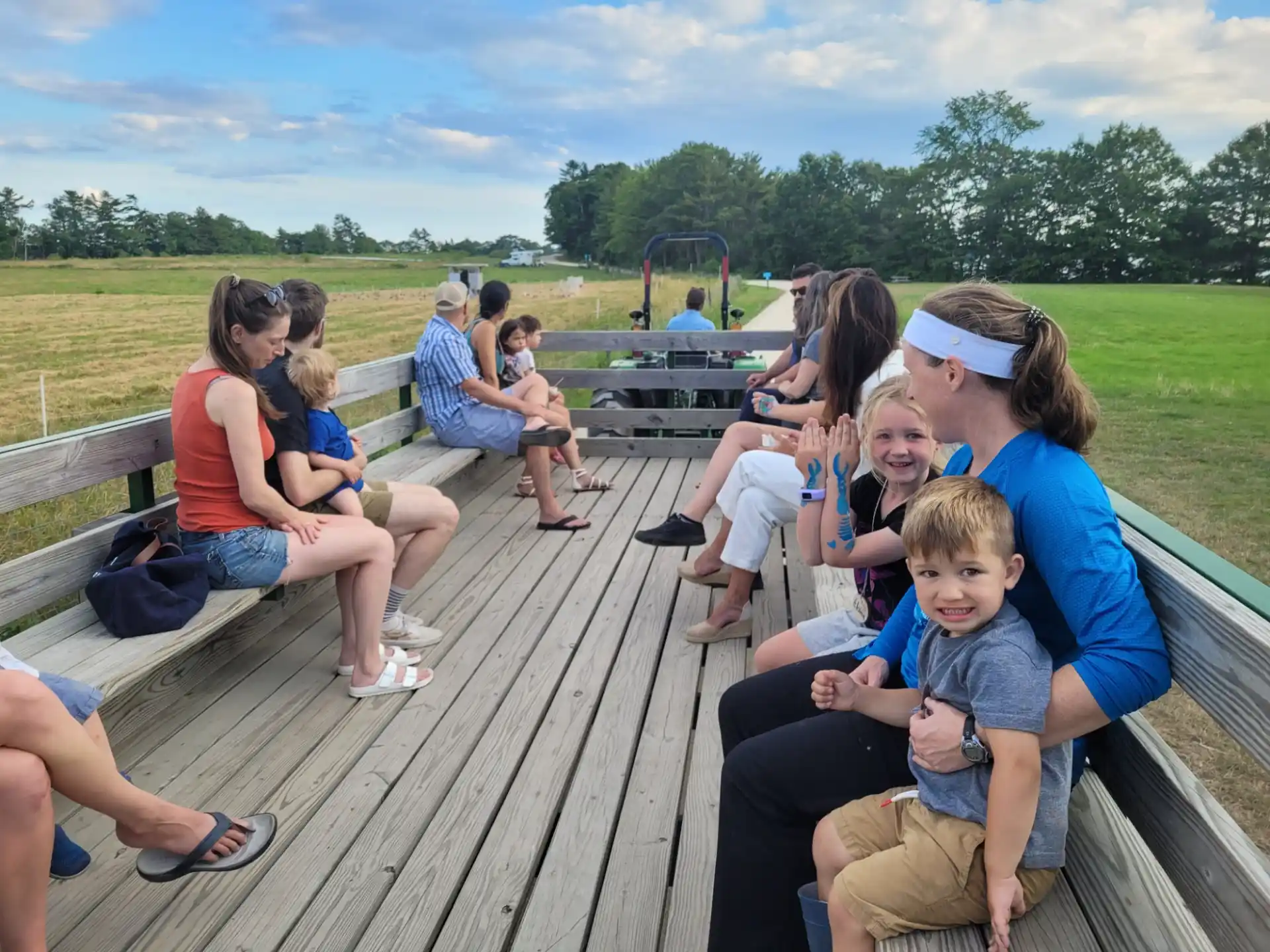 a group of people sitting on a picnic table