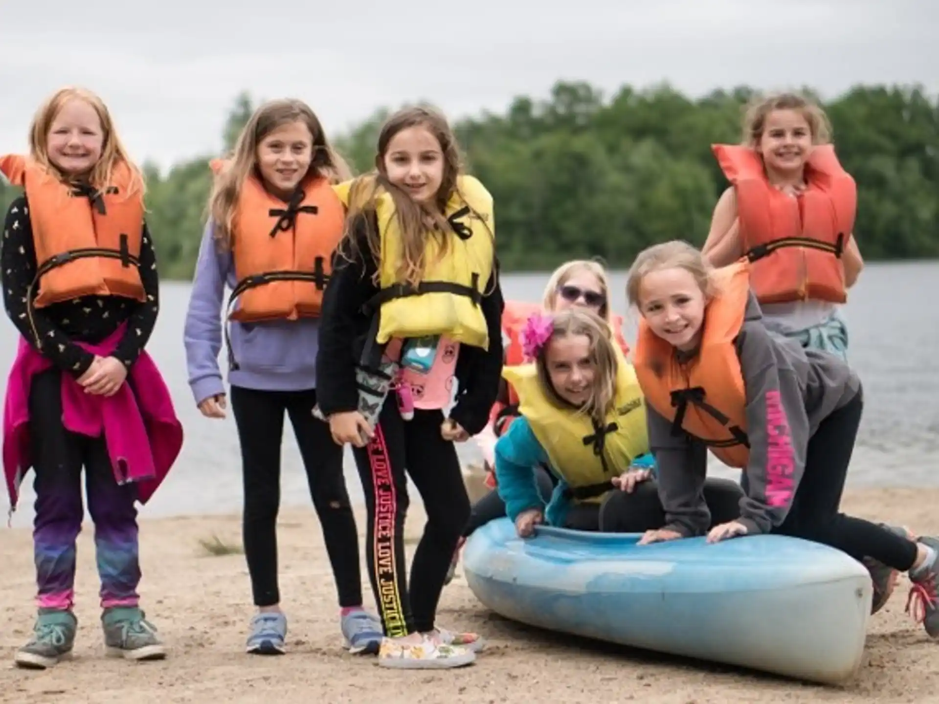 a group of people wearing life jackets