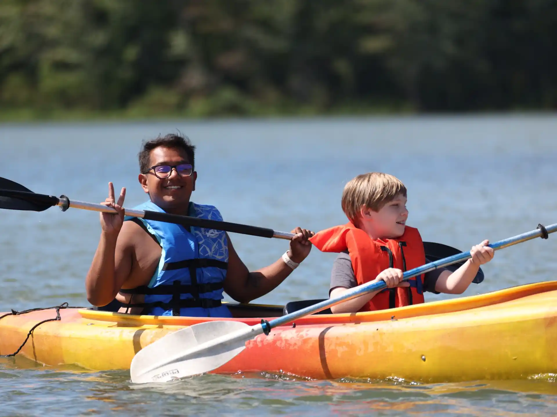 a person and a boy in a canoe