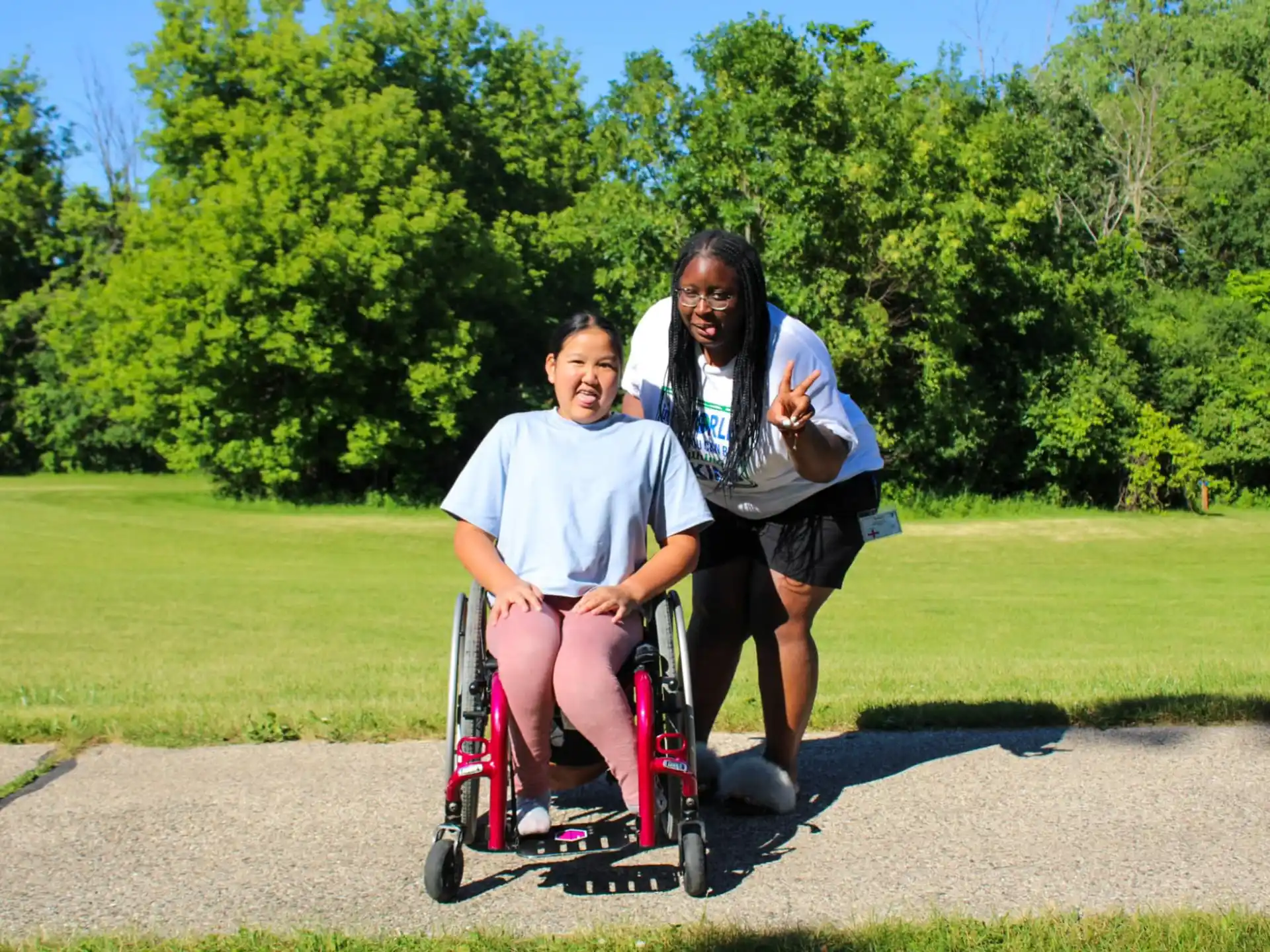a man and a woman on a tricycle in a park