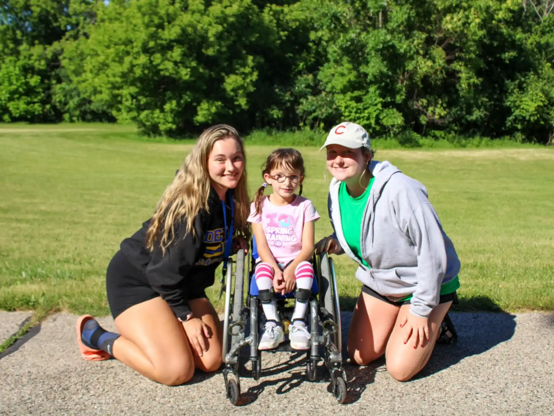 a man and woman with a child in a wheelchair