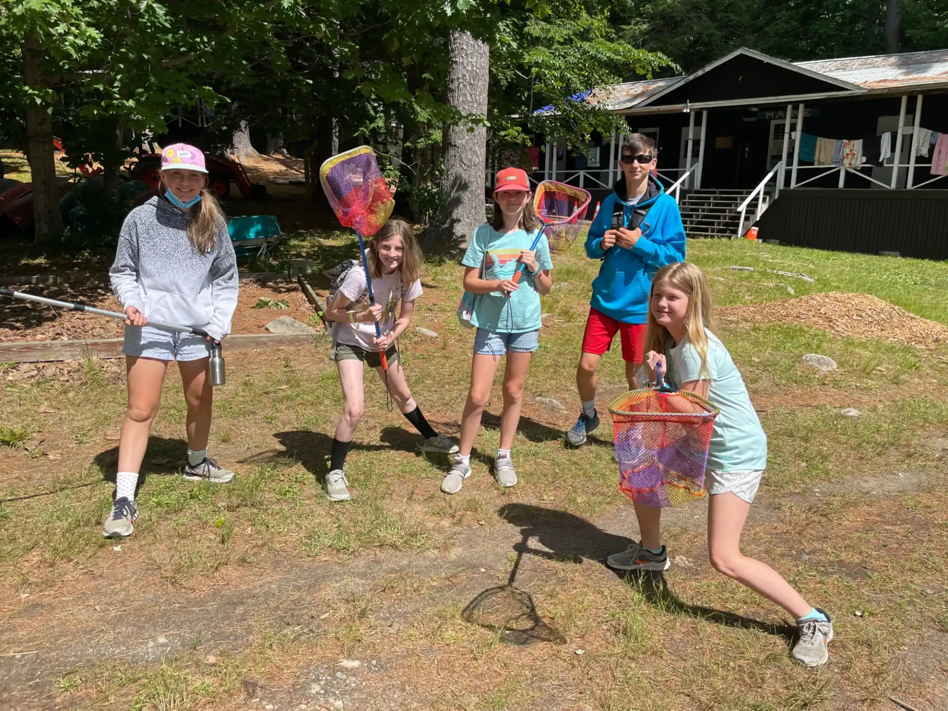 a group of people holding baskets