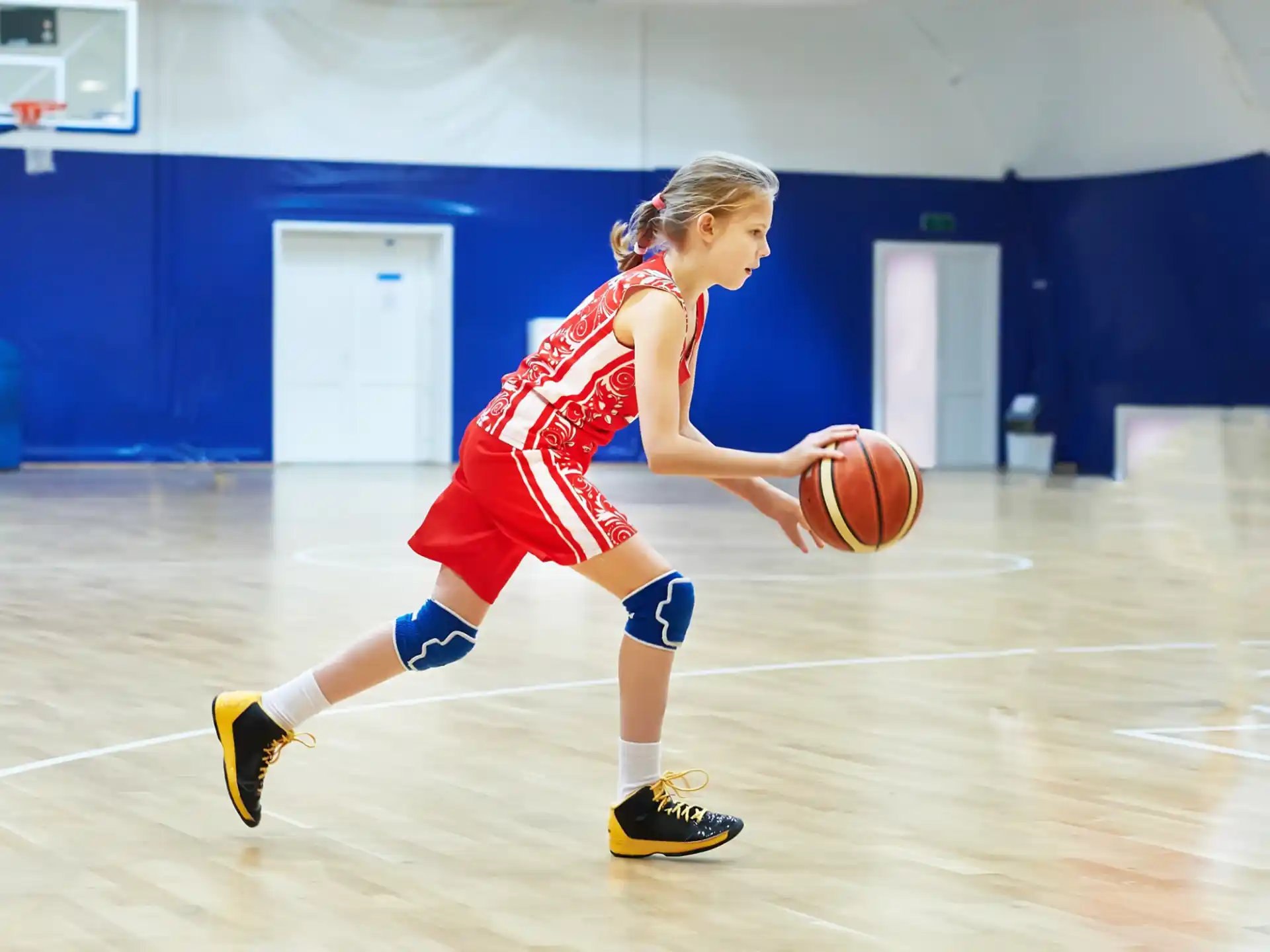 a girl playing basketball