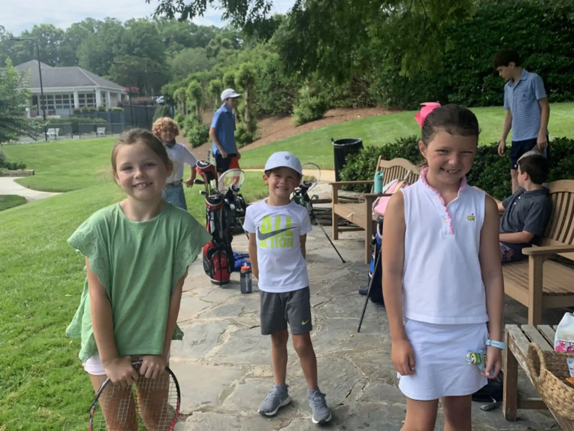 a group of kids standing outside
