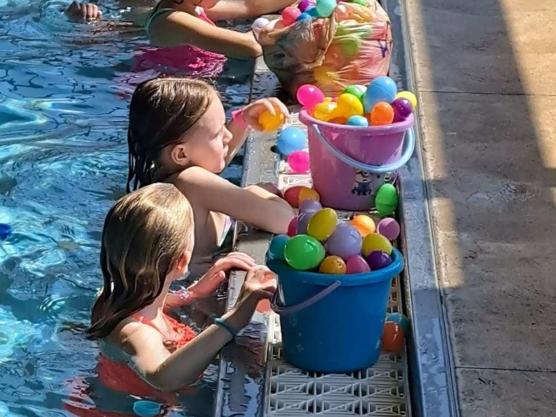 a group of children in a pool