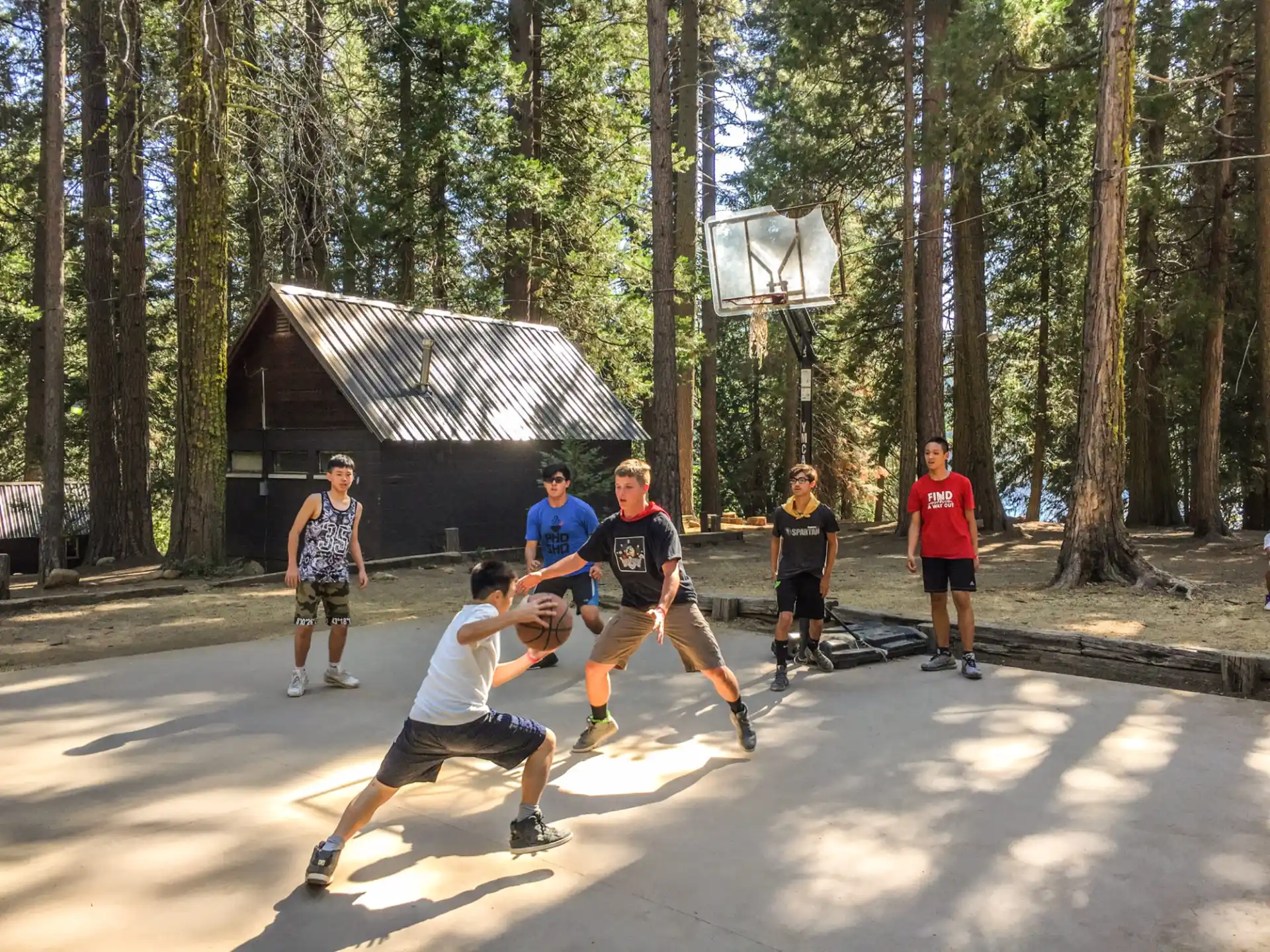 a group of people playing basketball