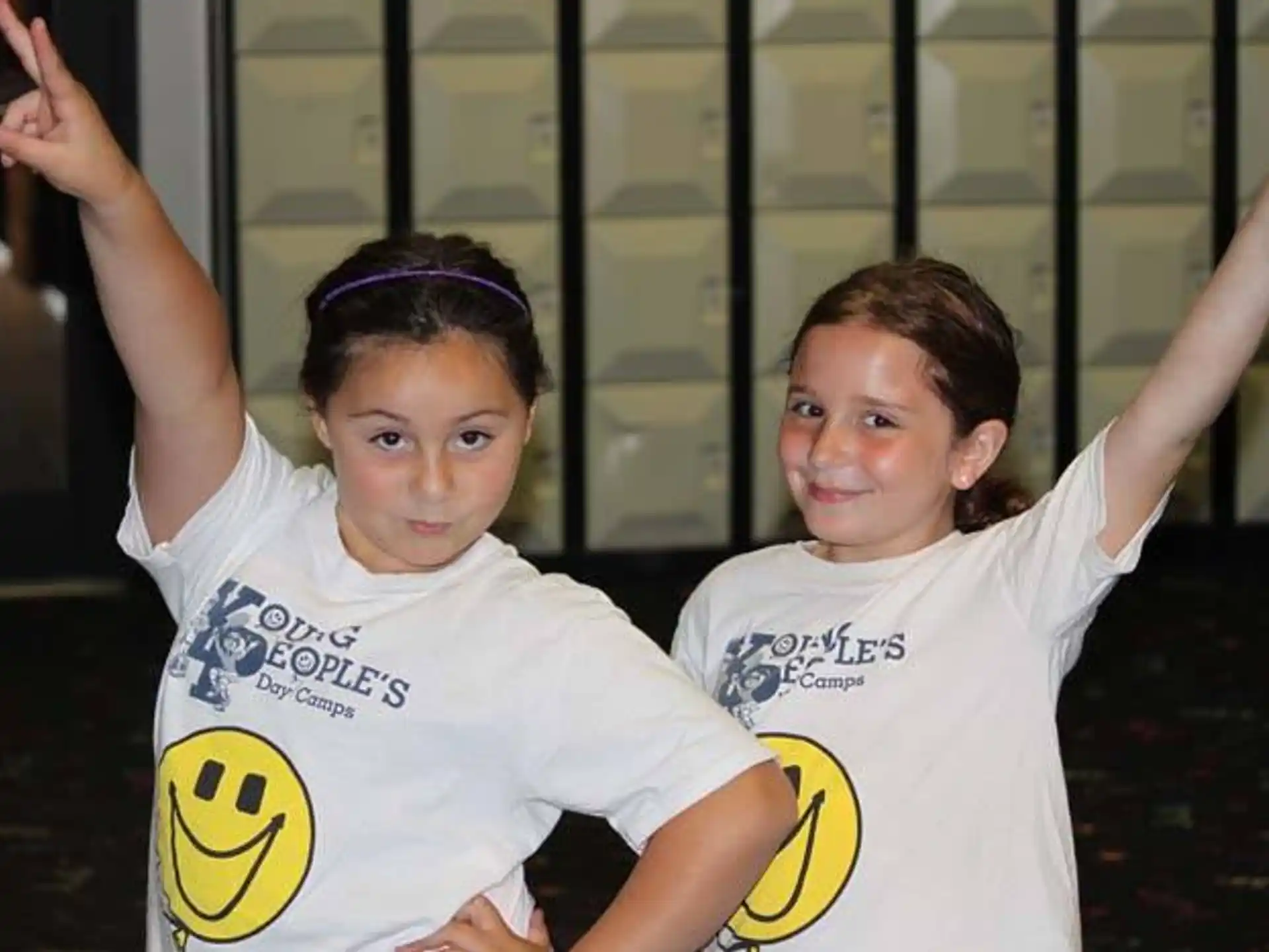 two girls in white shirts