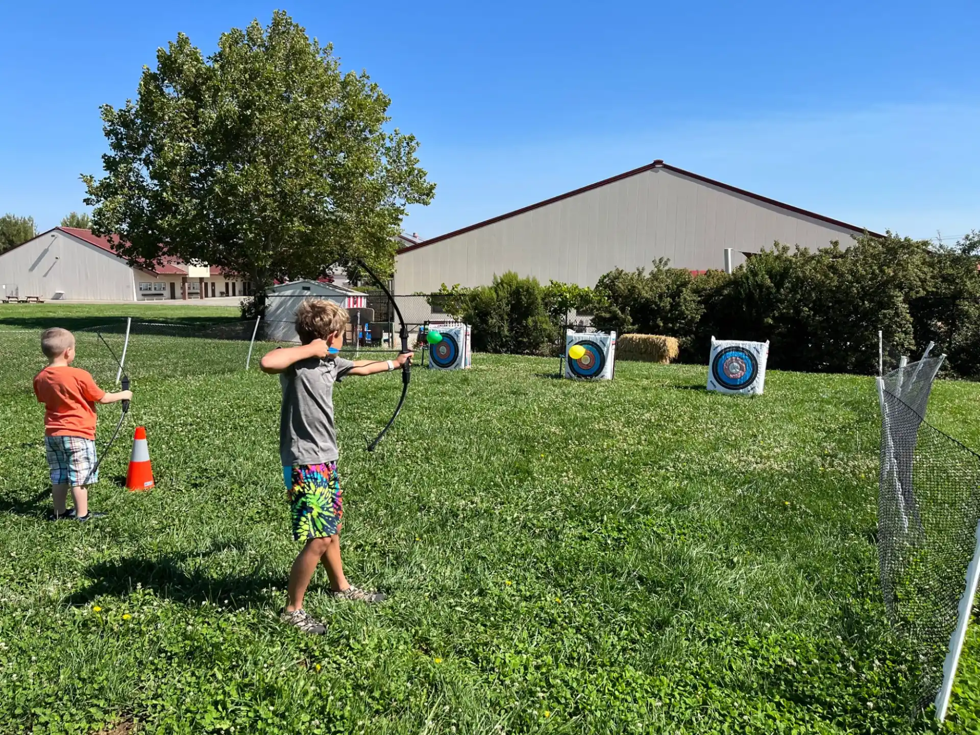 a couple of kids playing in a yard