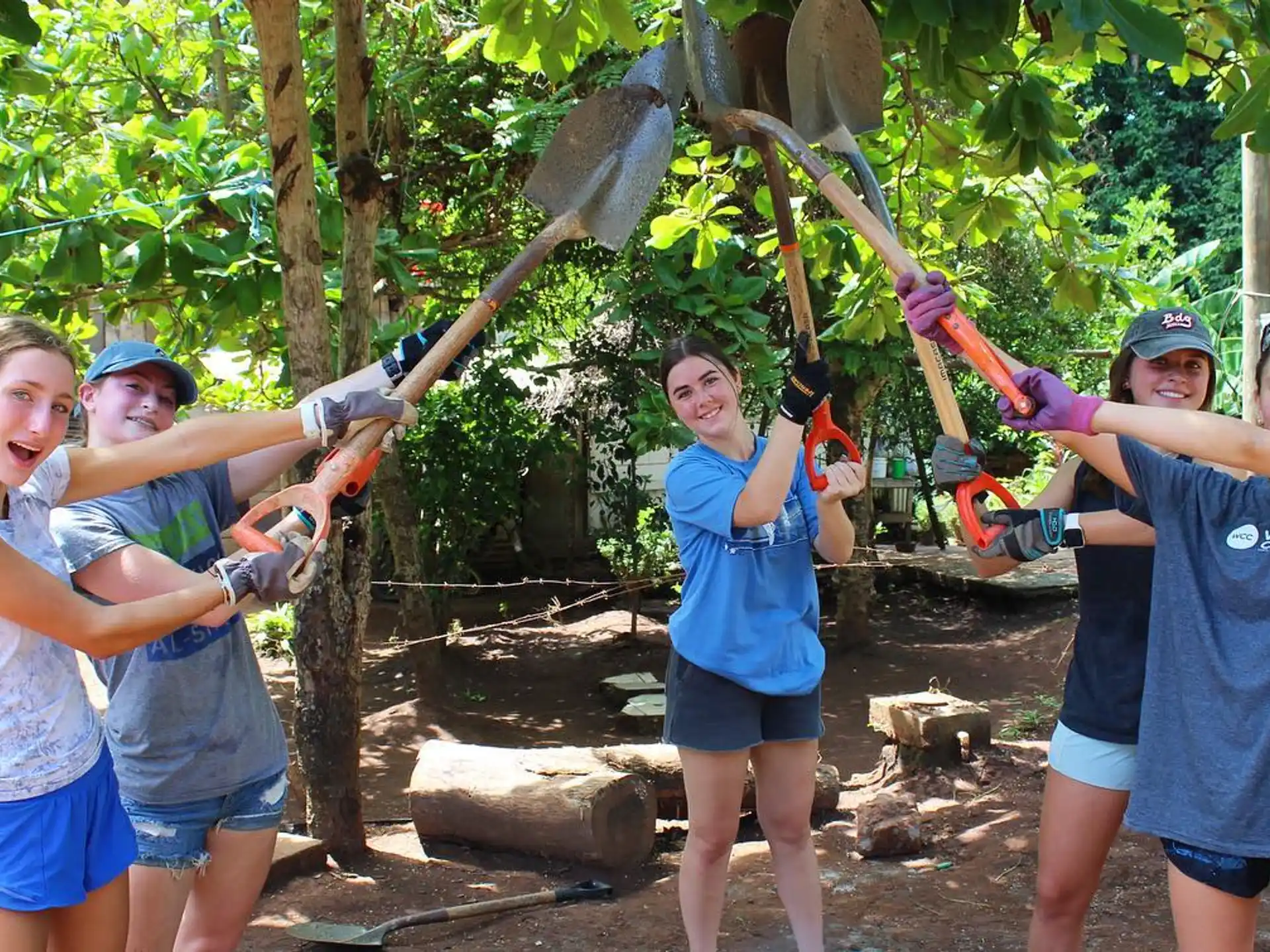 a group of people holding a large sword