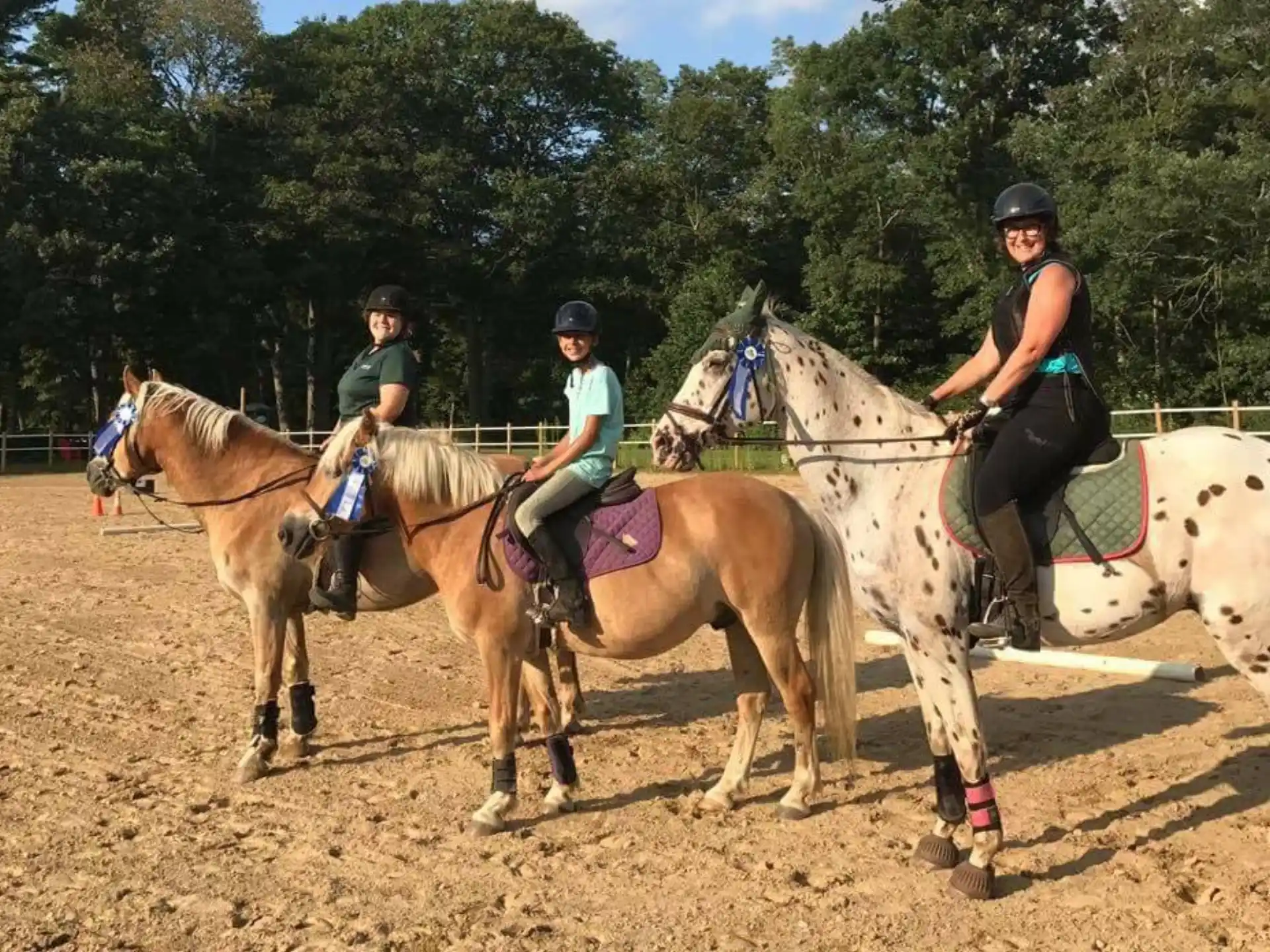 a group of people riding horses