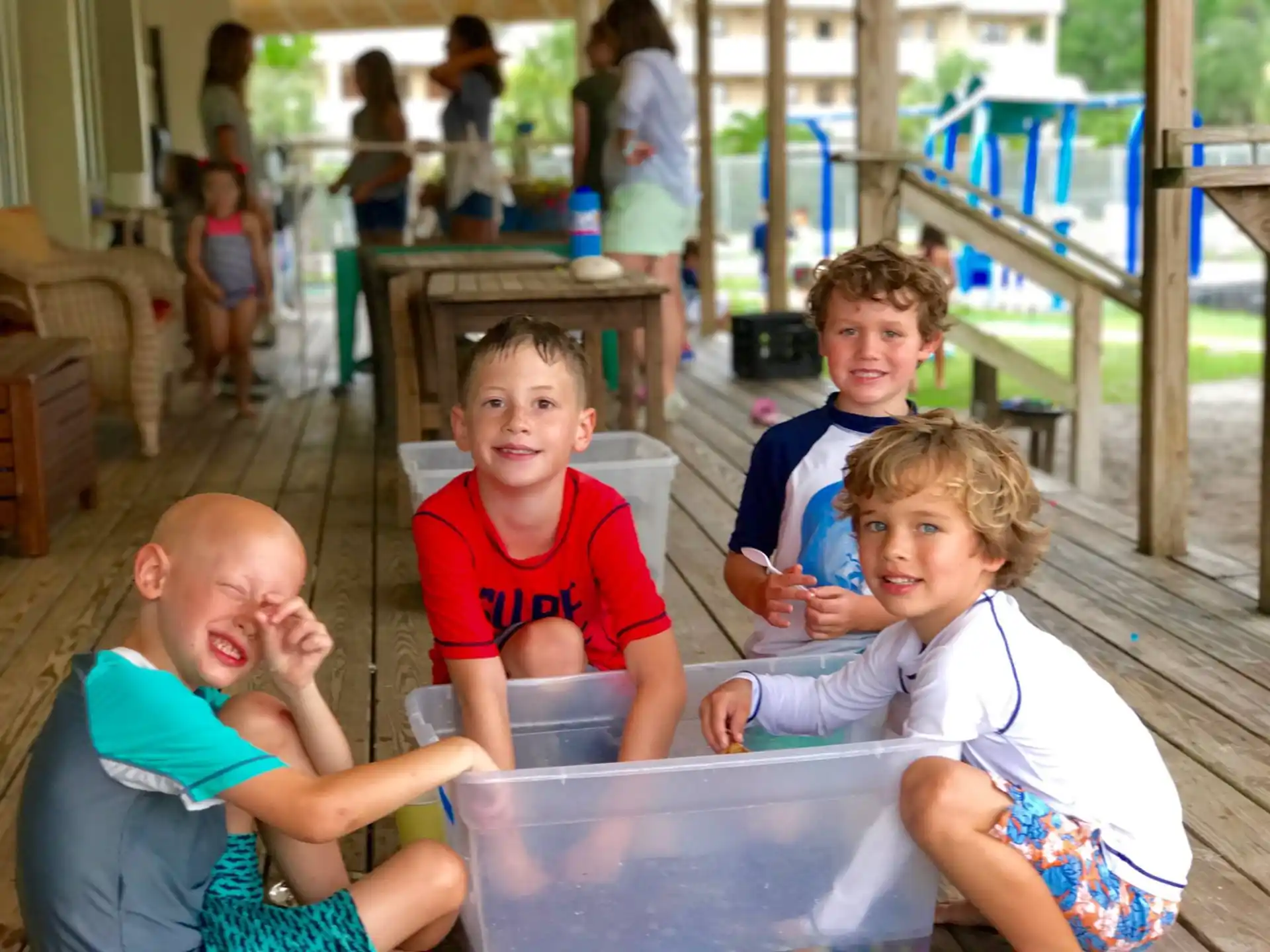 a group of children sitting at a table