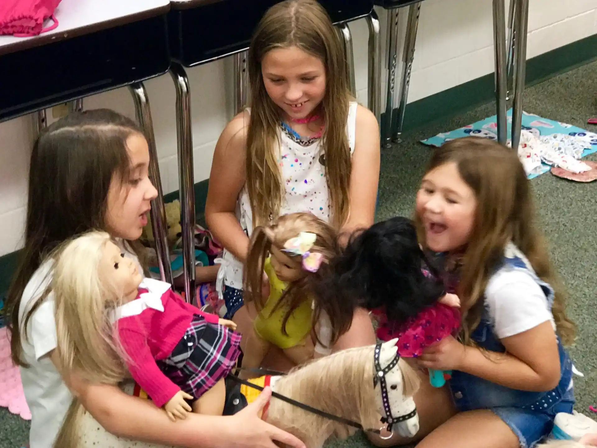 a group of girls and a dog