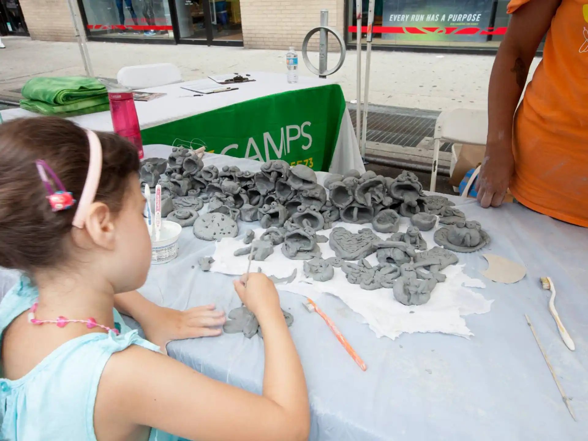 a girl painting on a table