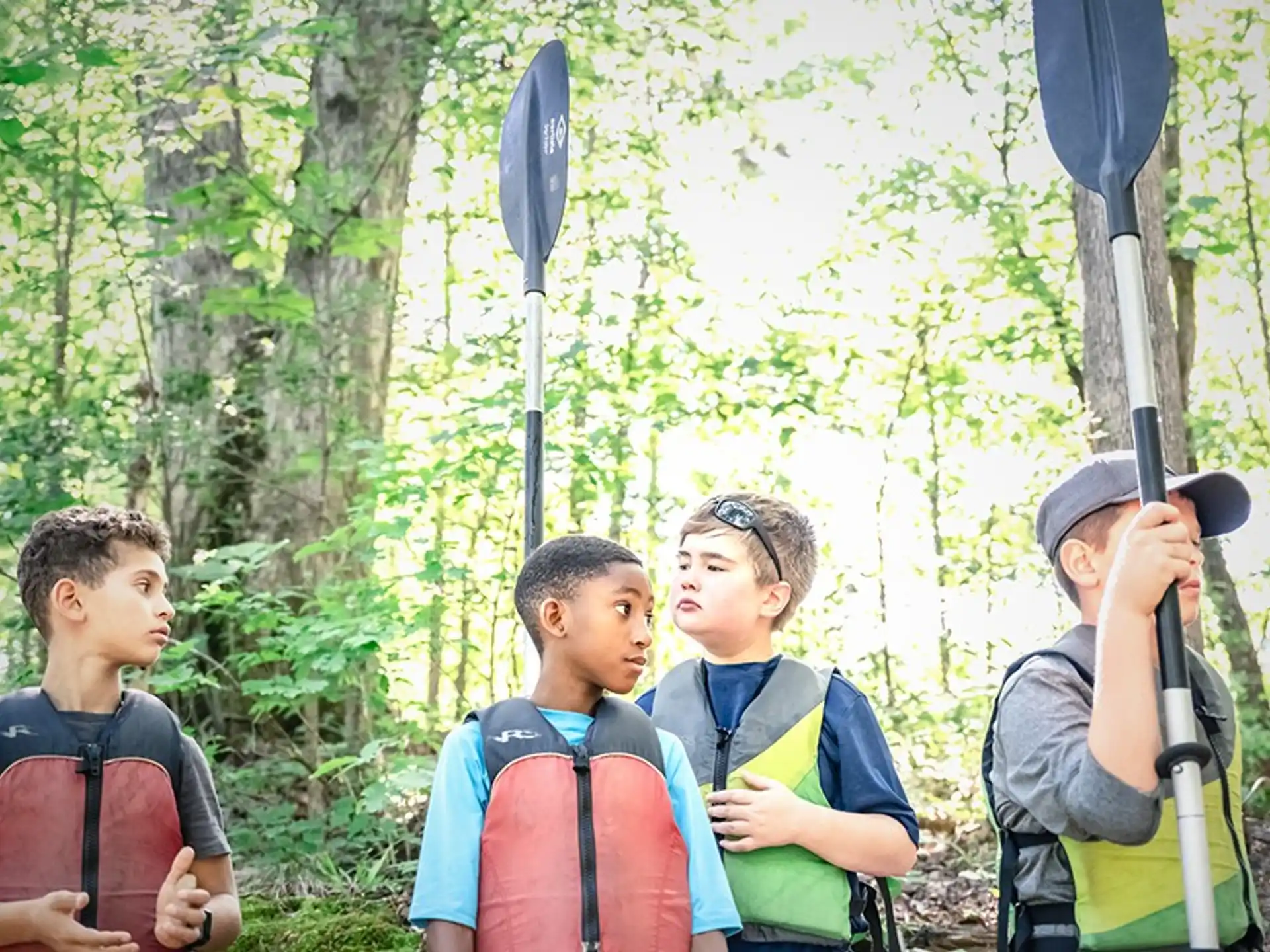 a group of boys in the woods