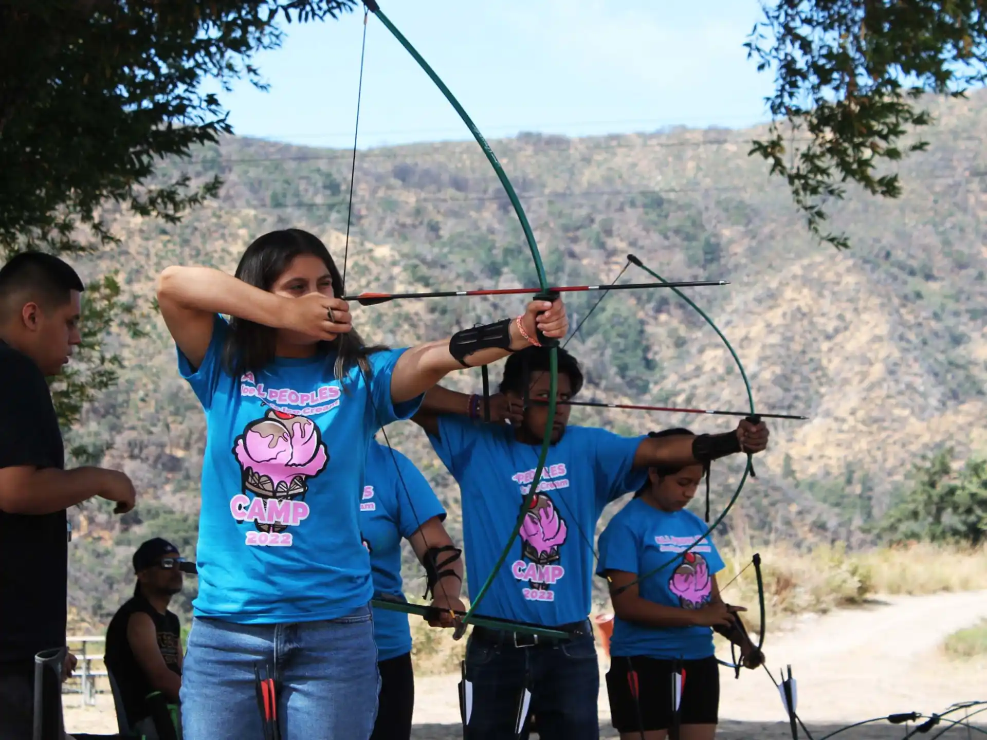 a group of people holding onto a rope