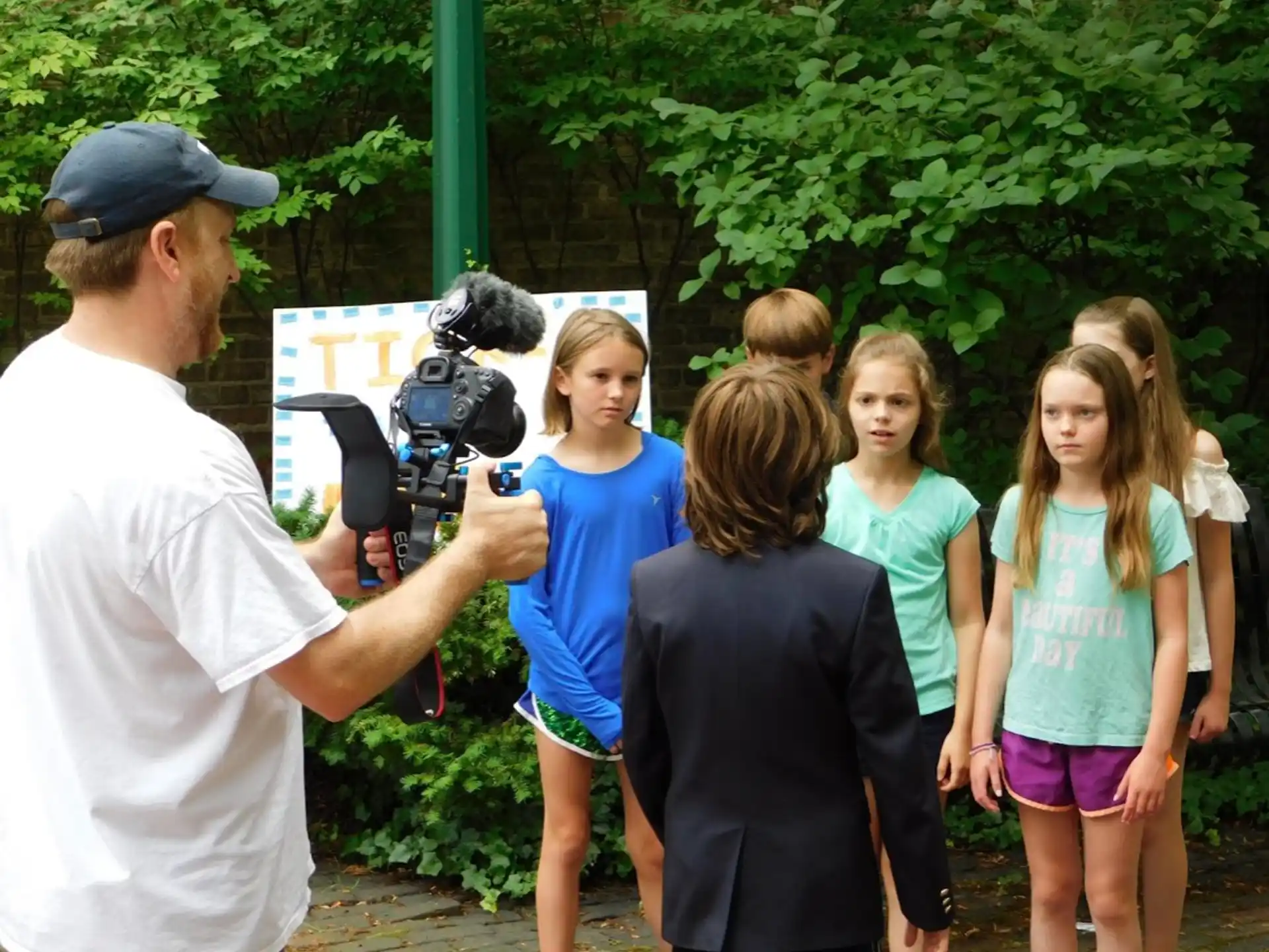 a person talking to a group of girls