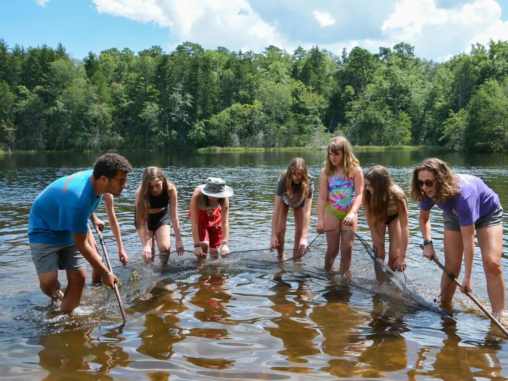 a group of people in a river