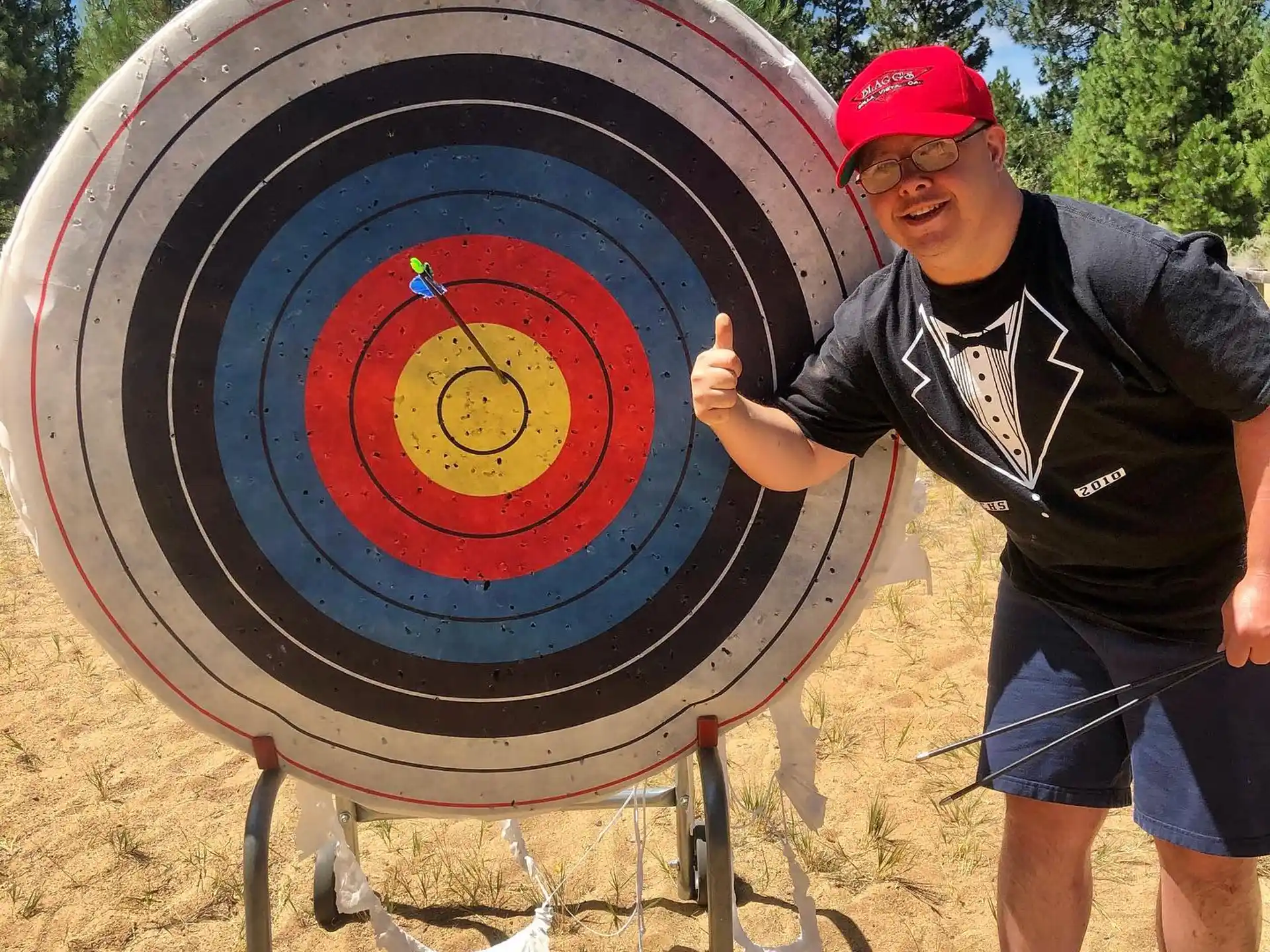 a man holding a large blue and red shield