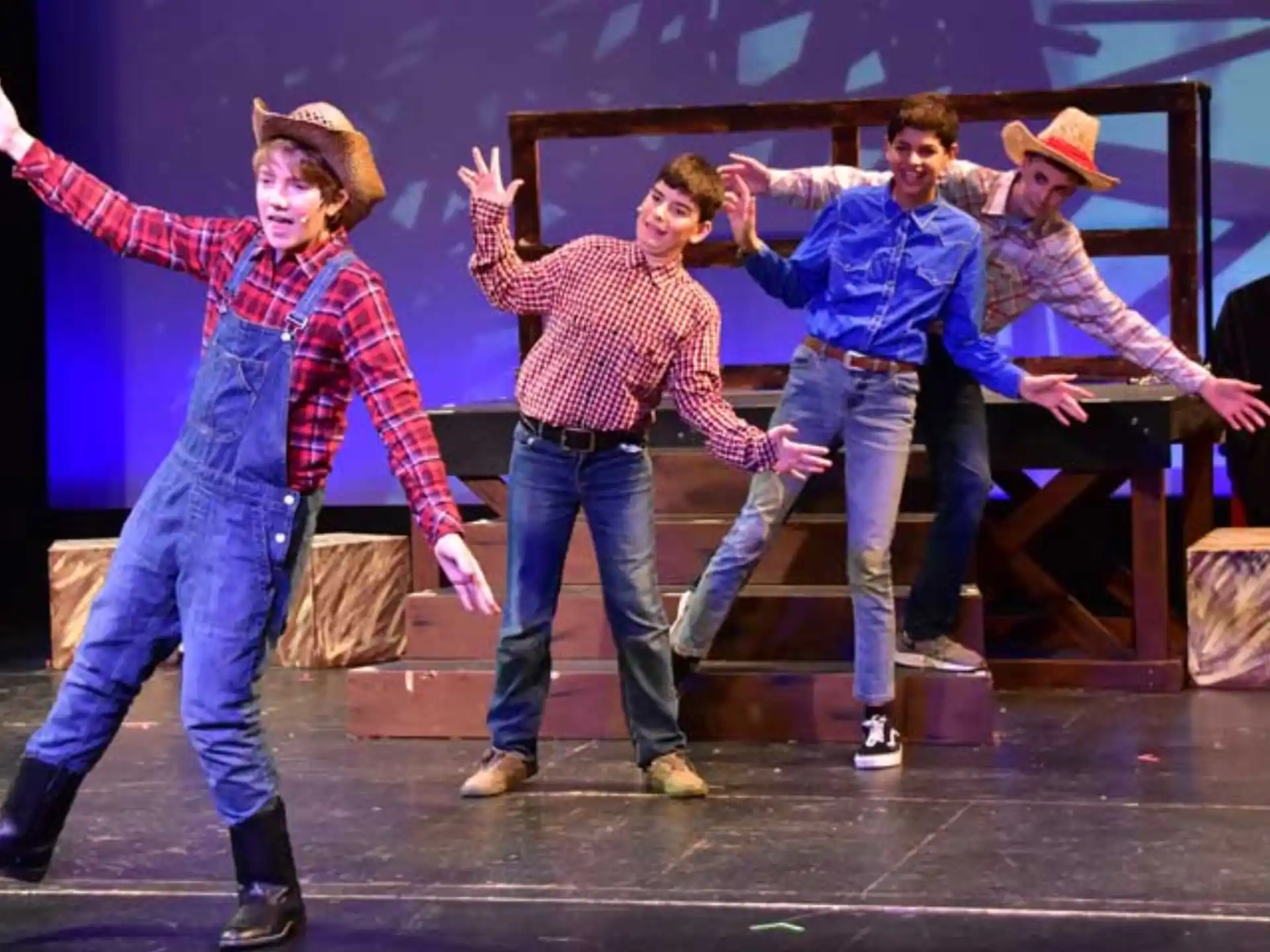 a group of men dancing on a stage