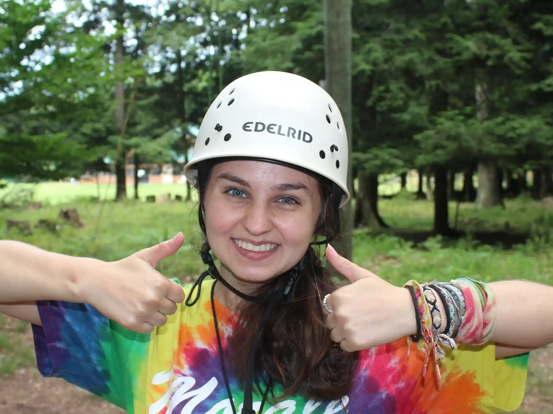 a person wearing a helmet and posing for the camera