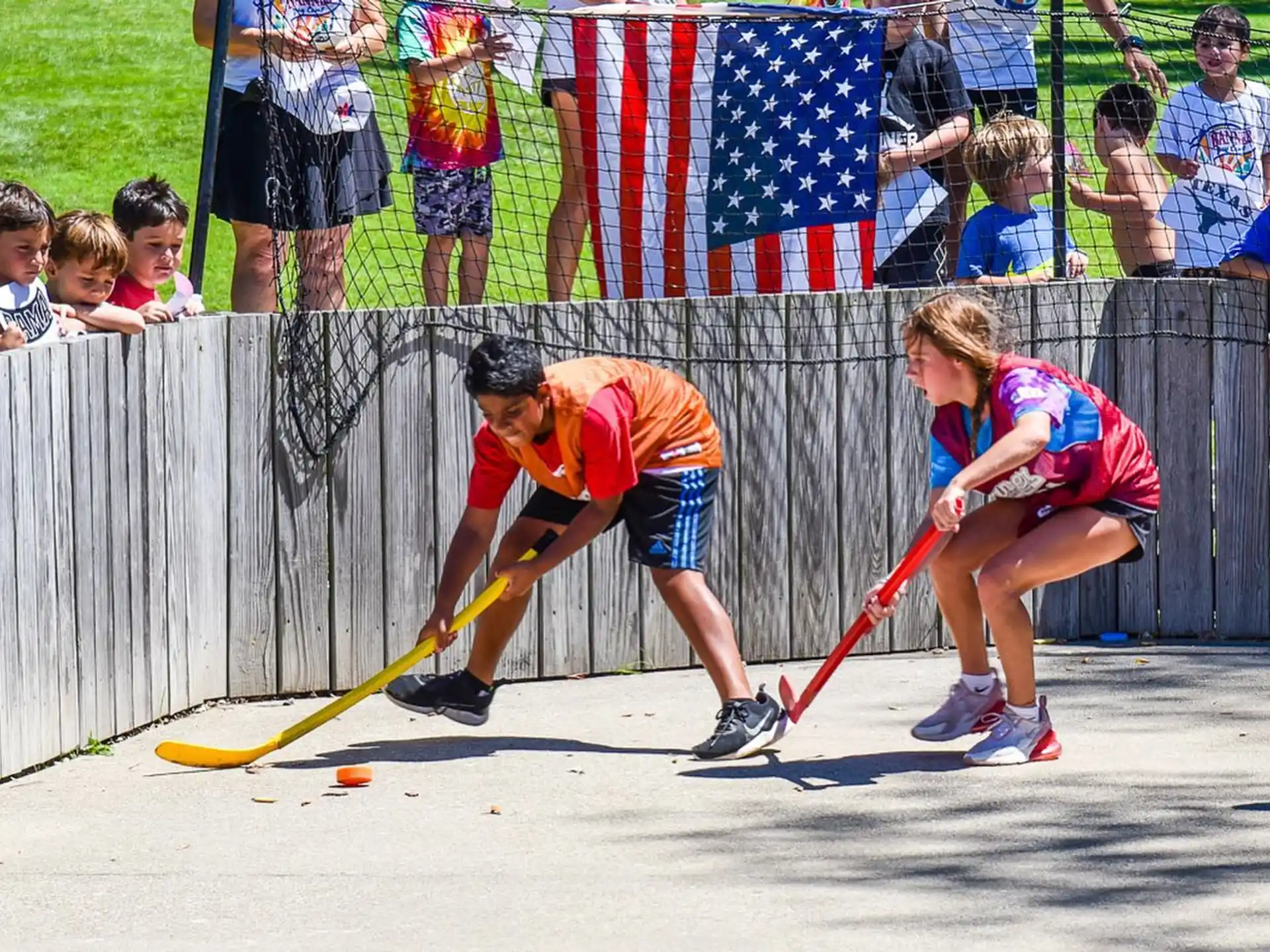 a group of people playing hockey