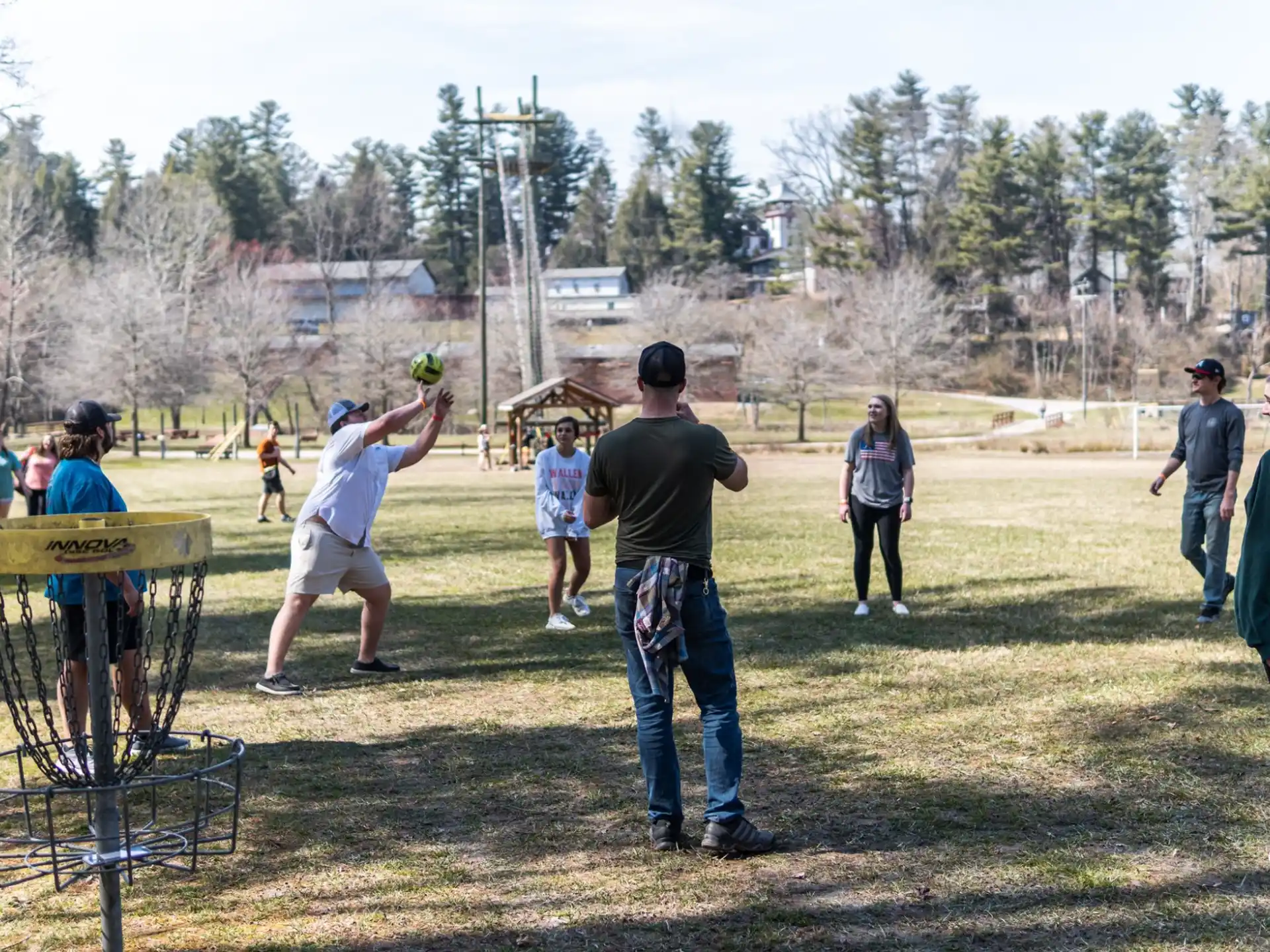 a group of people playing baseball