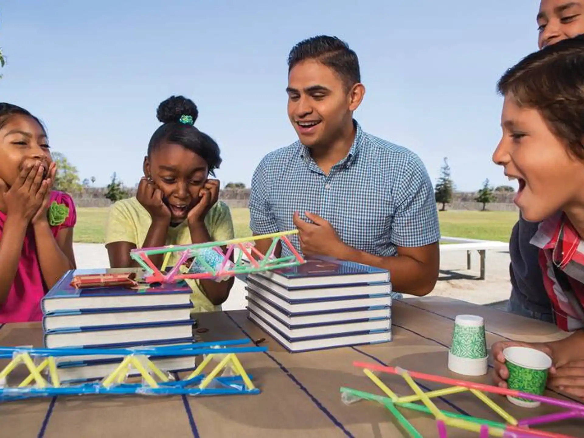 a group of people sitting at a table with a board game