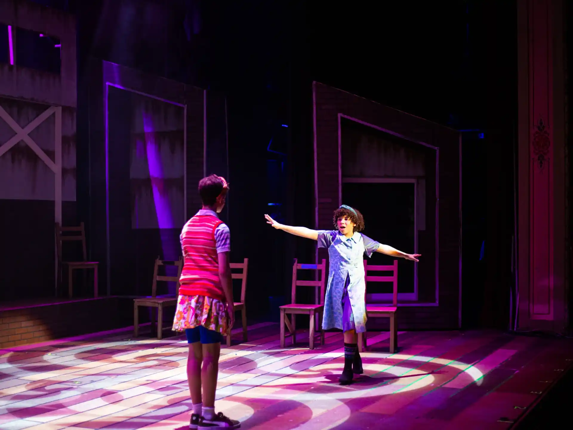 a man and a woman dancing on a stage