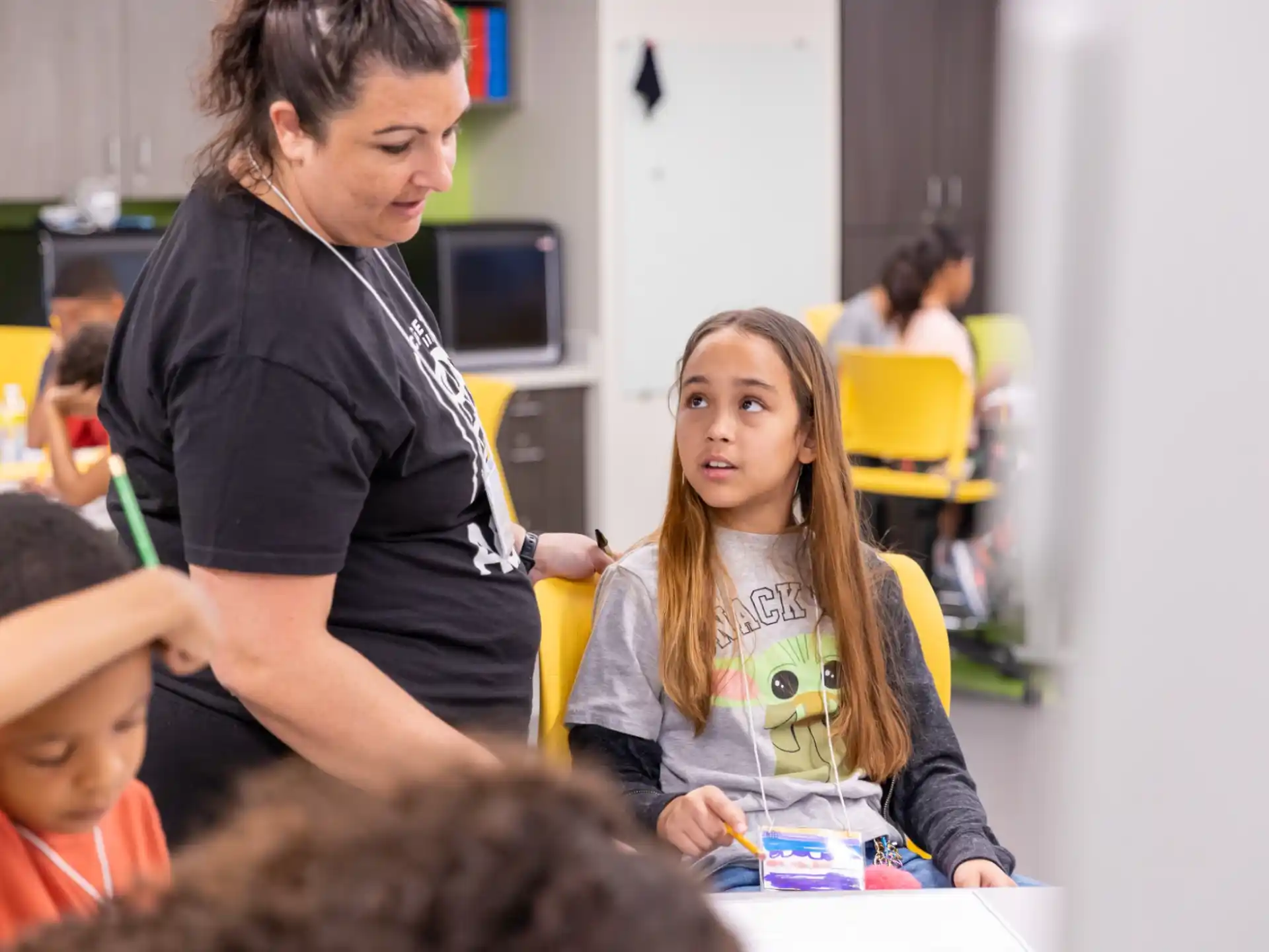 a teacher teaching a student