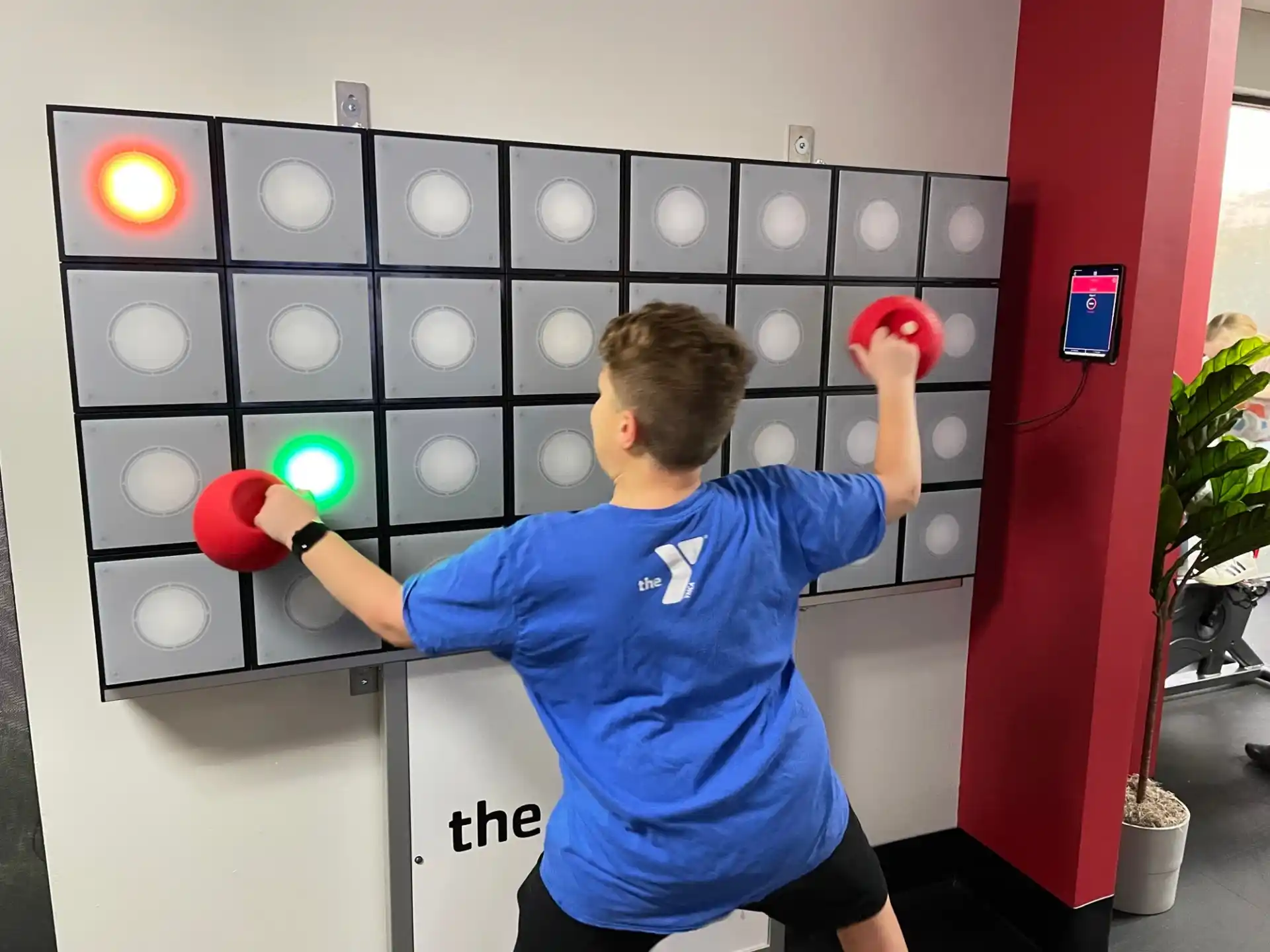 a boy holding boxing gloves