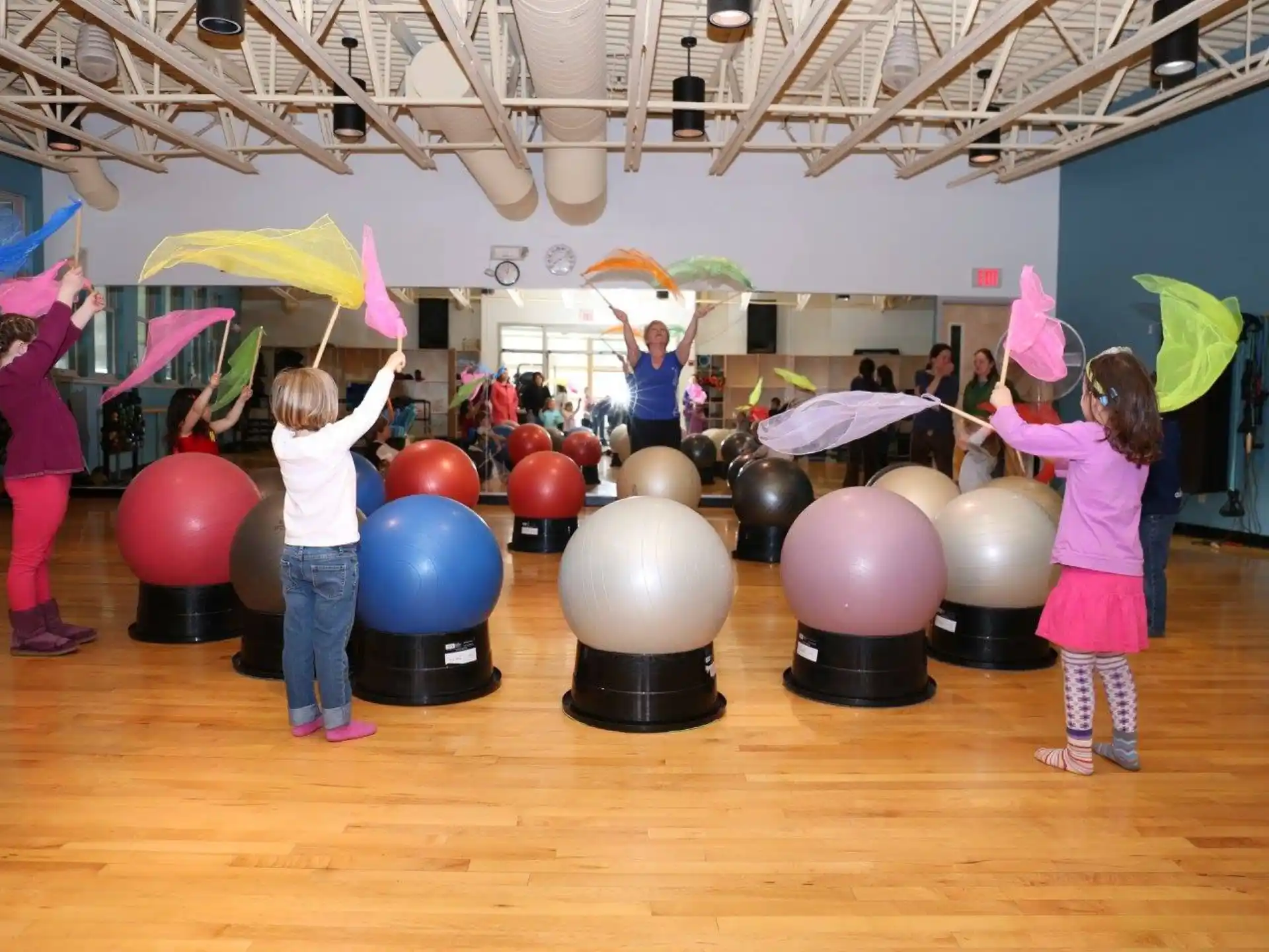 a group of children holding balloons