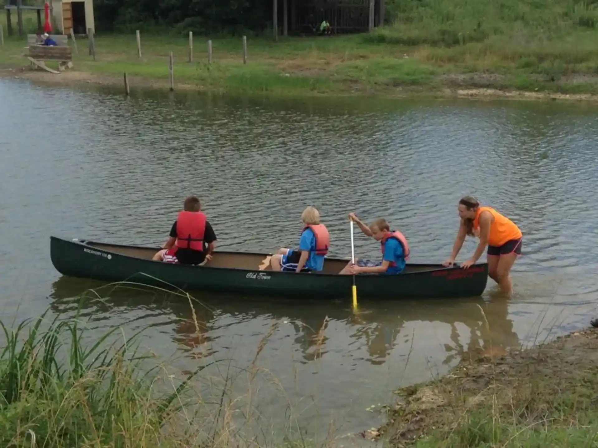 a group of people in a canoe