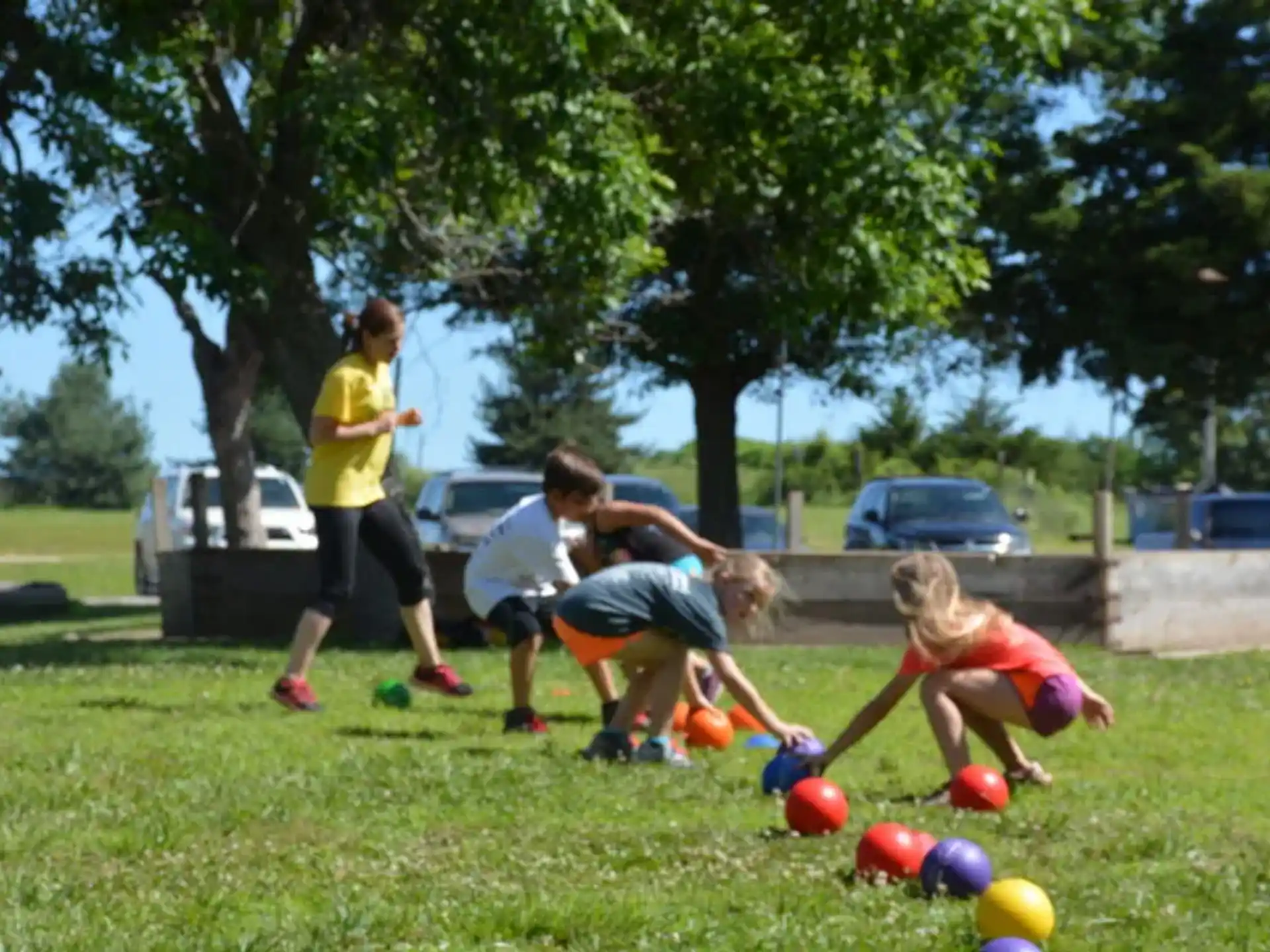 a group of people playing with balls