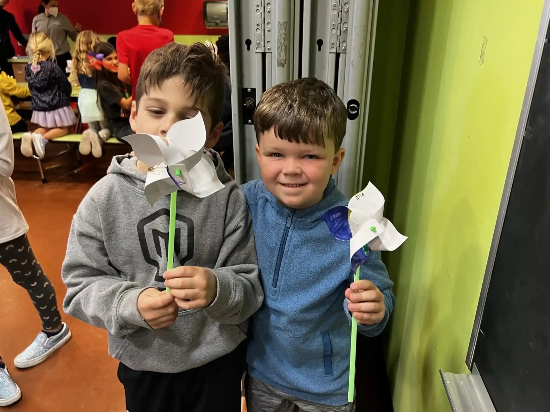 a couple of boys holding a toy