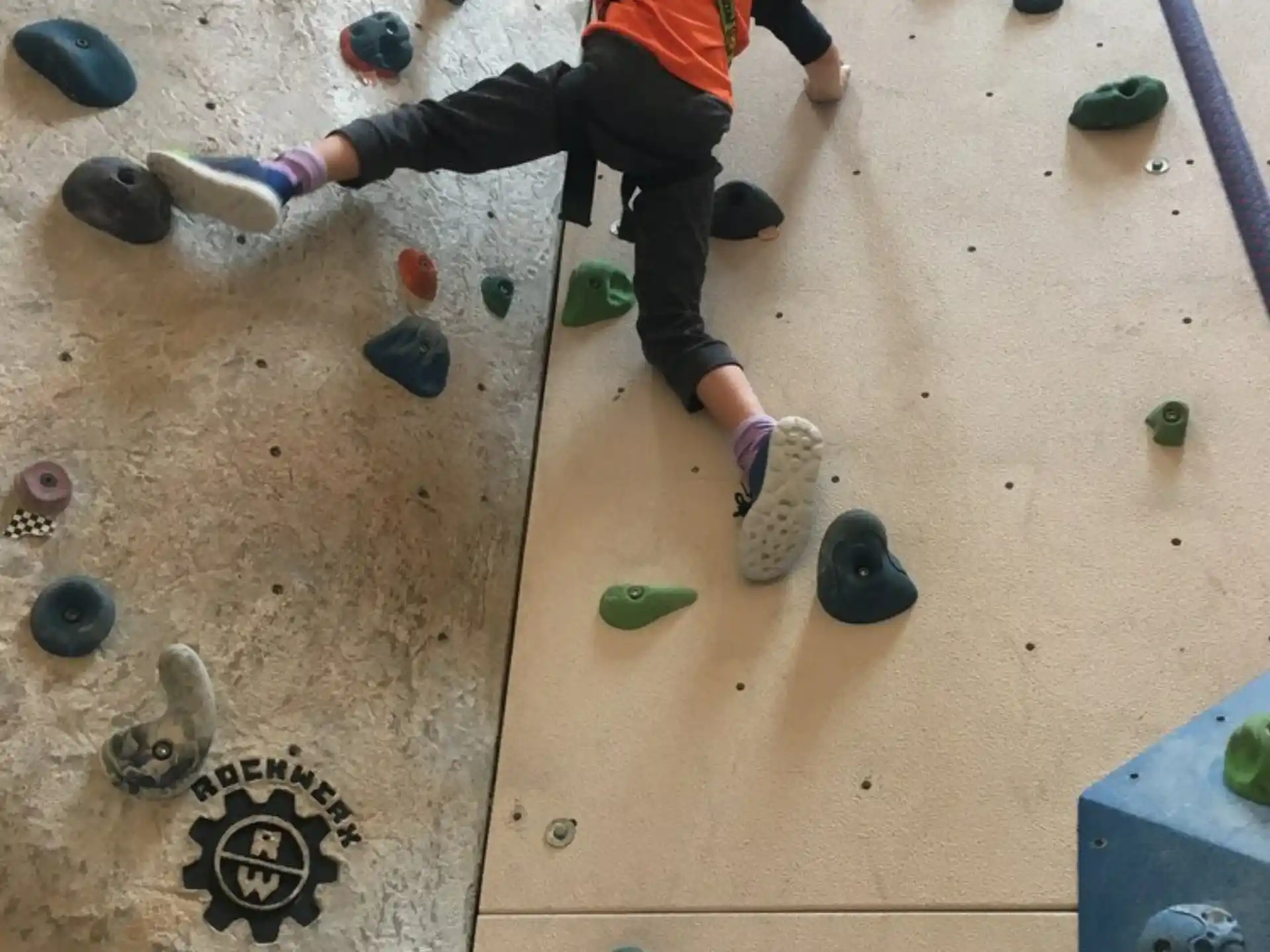 a person climbing a rock wall