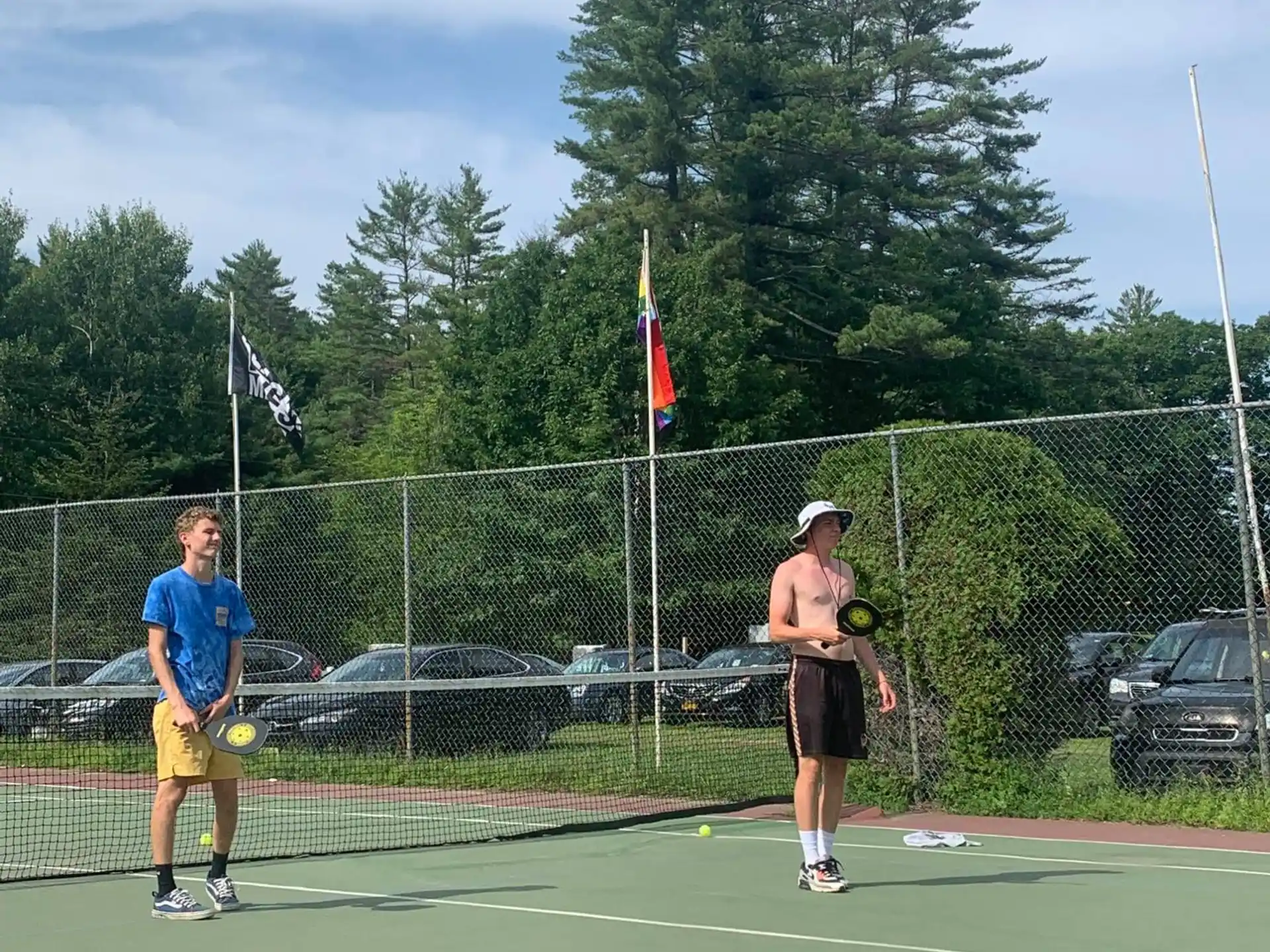 a couple of people play tennis