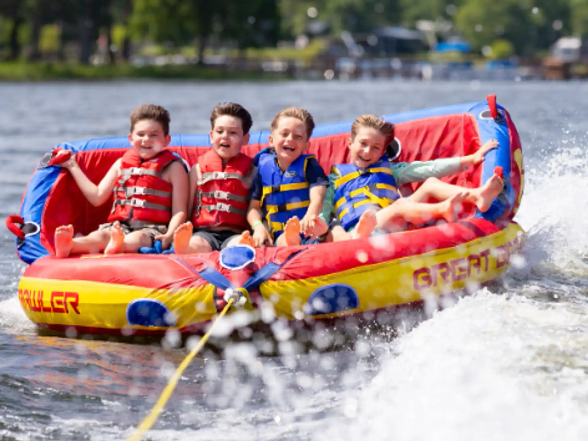 a group of kids in a raft