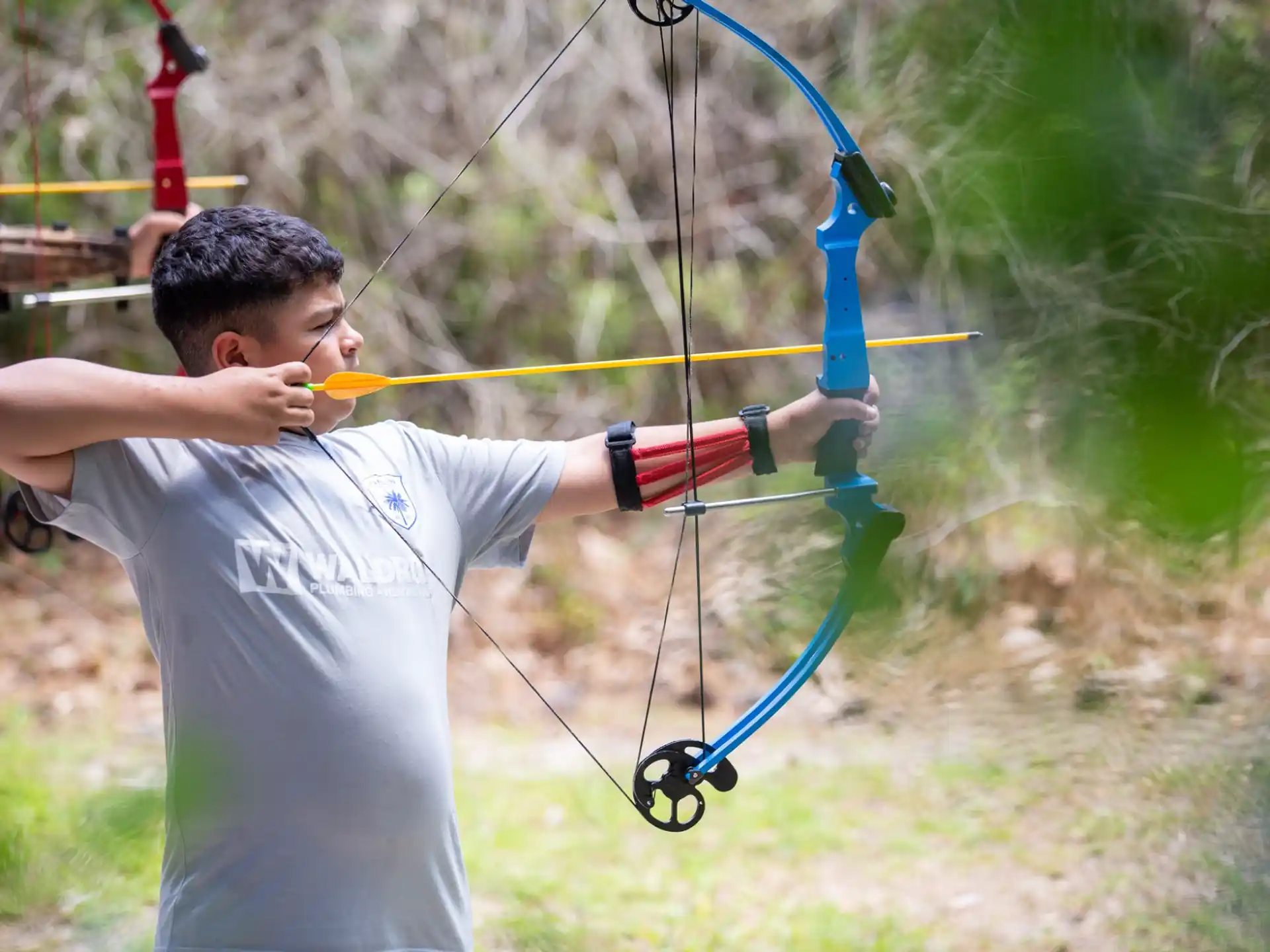a man shooting a bow