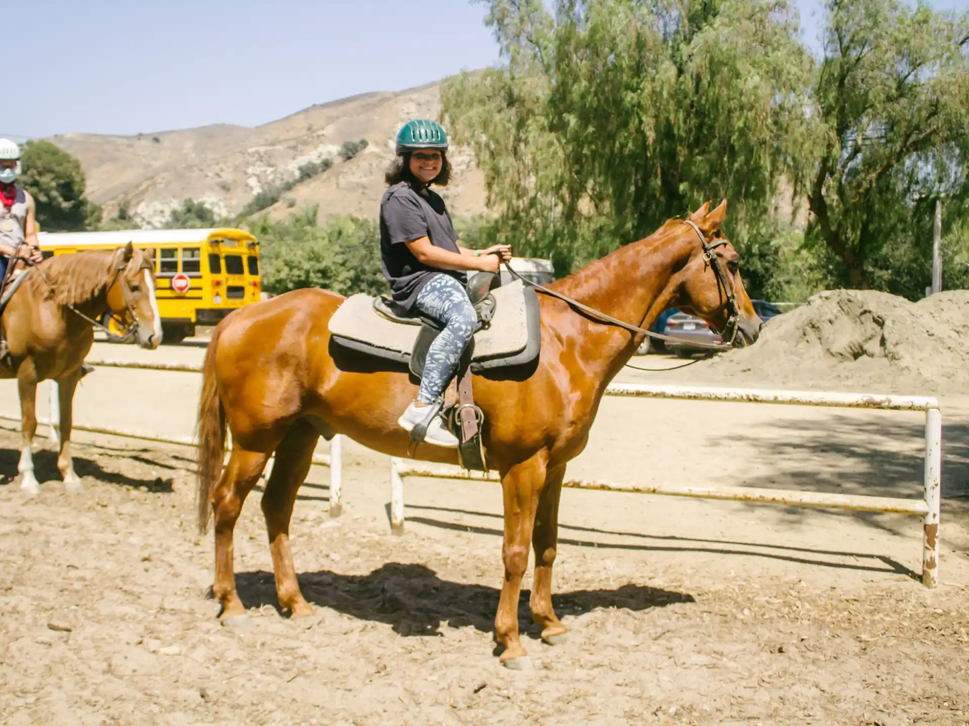 a couple of people riding horses