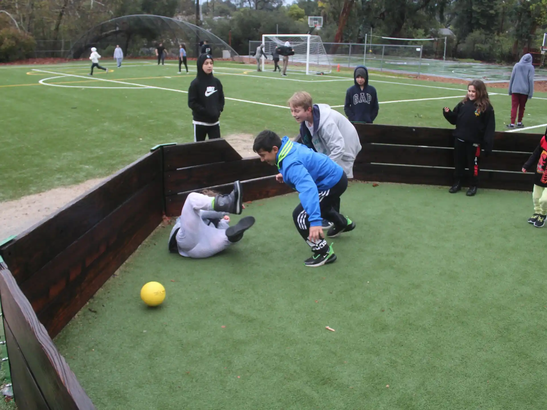 a group of people playing football